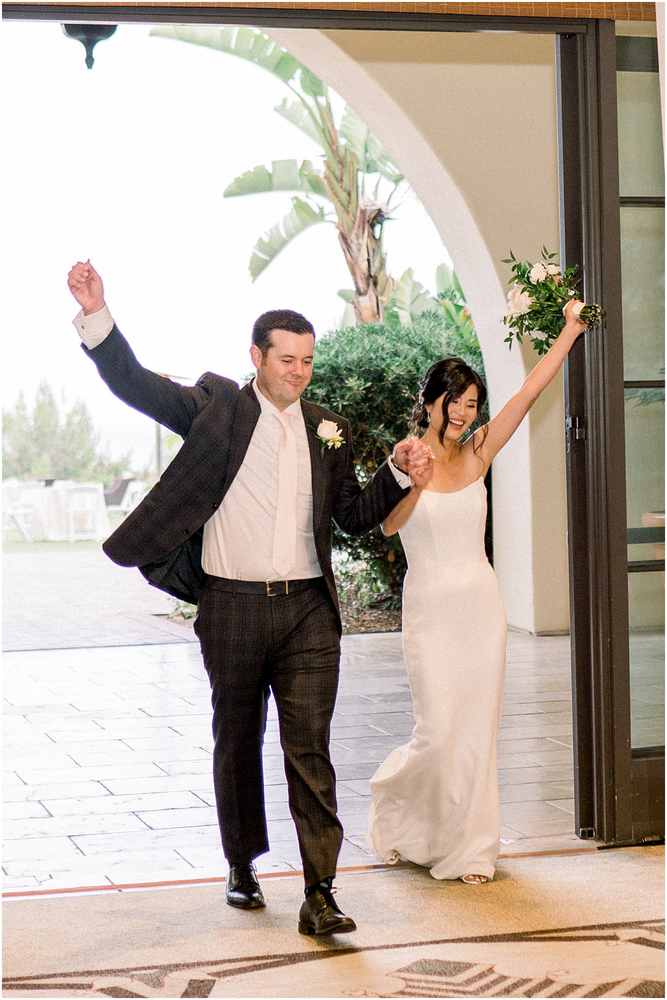 Bride and groom during grand entrance at Terranea Resort.