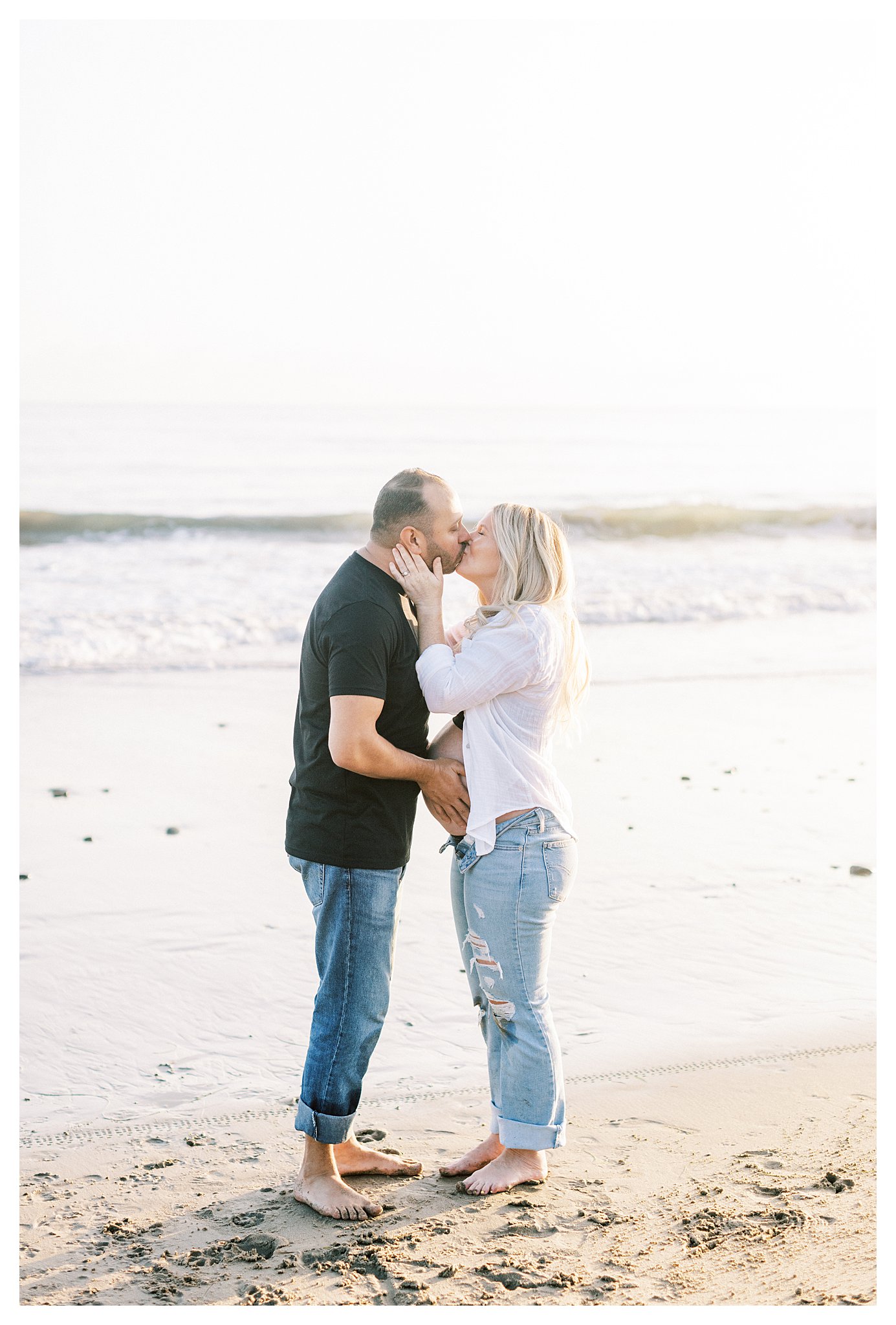 A couple kissing during their maternity session in Malibu, Ca. 