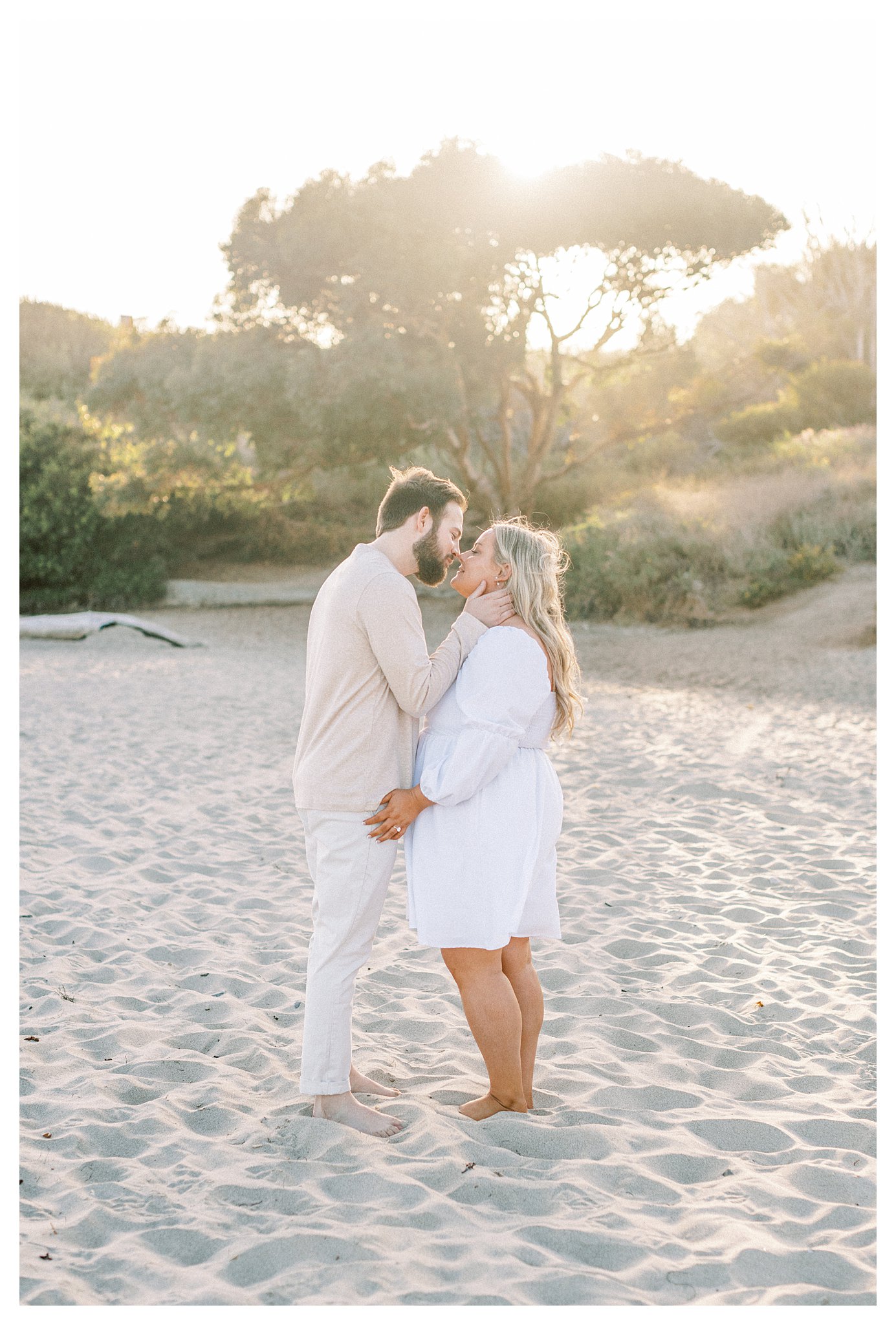 An engagement session on the beach sealed with a kiss.