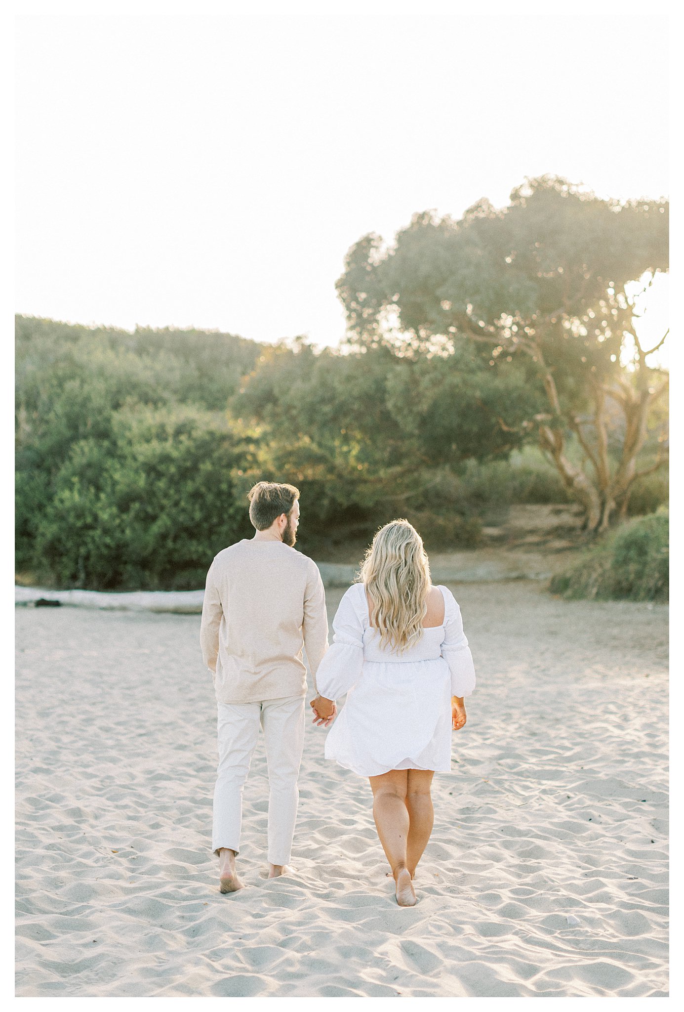 A couple in love walking along the beach.  