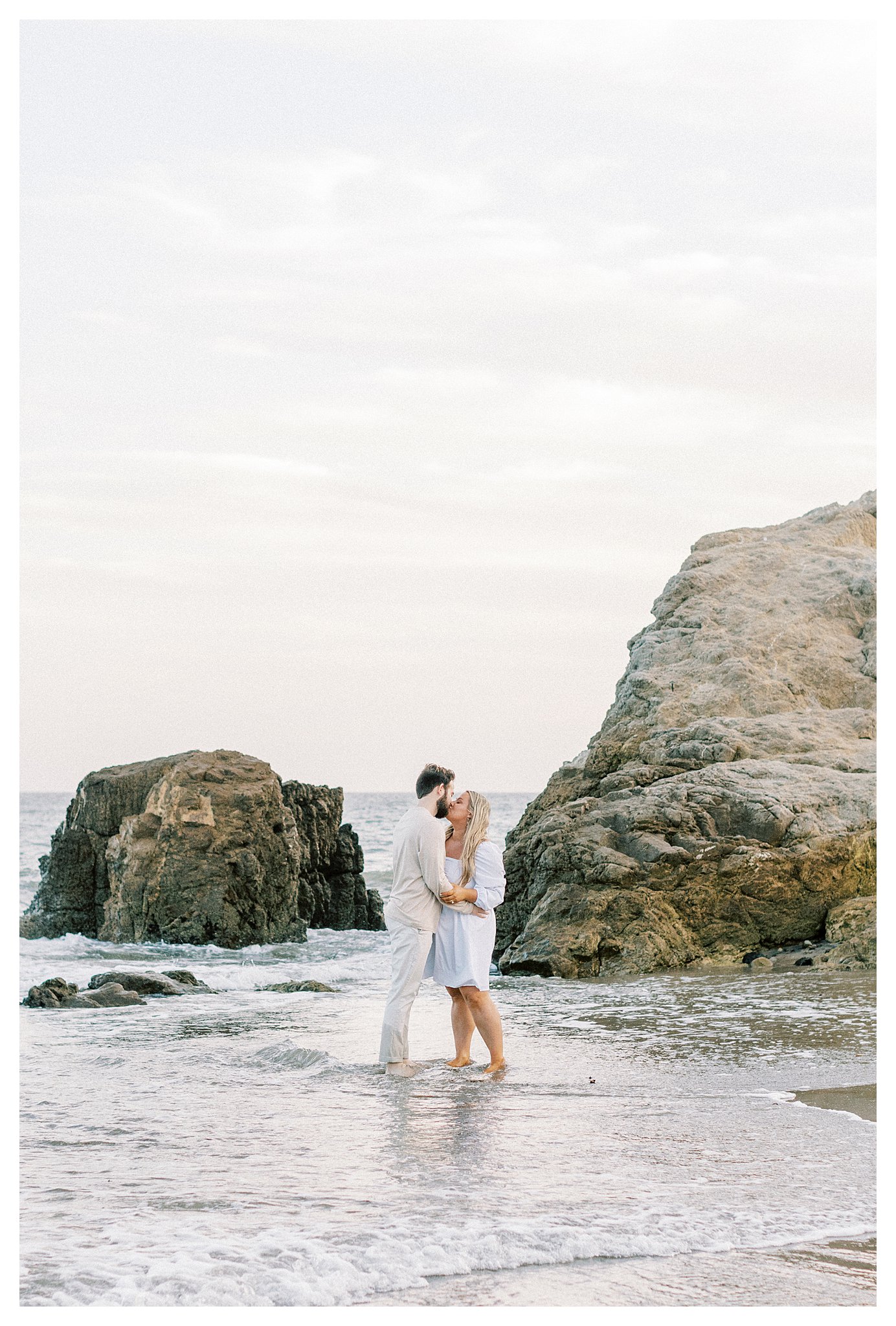 A kiss between a newly engaged couple near the tide pools at Leo Carrillo beach.