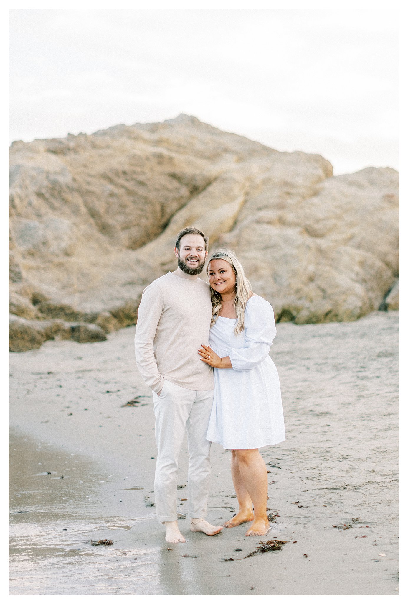 A couple posing for a photo during their engagement session in Malibu, Ca.