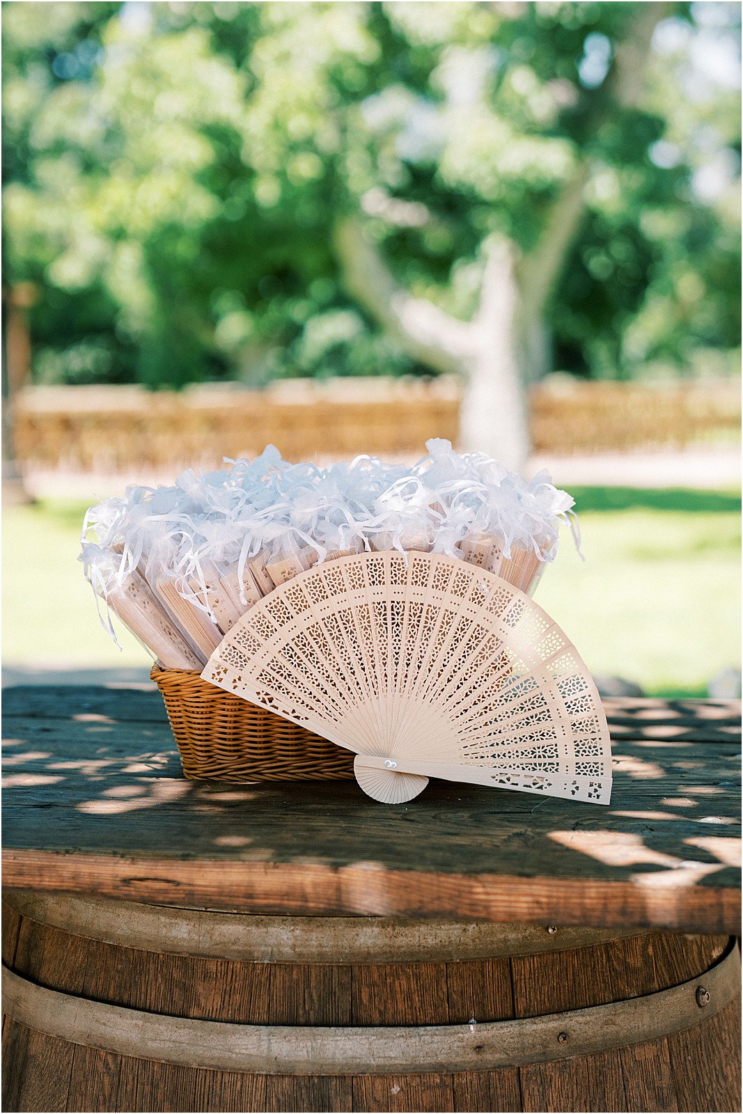 A fan for guests to use during a wedding on a warm day in Moorpark, Ca.