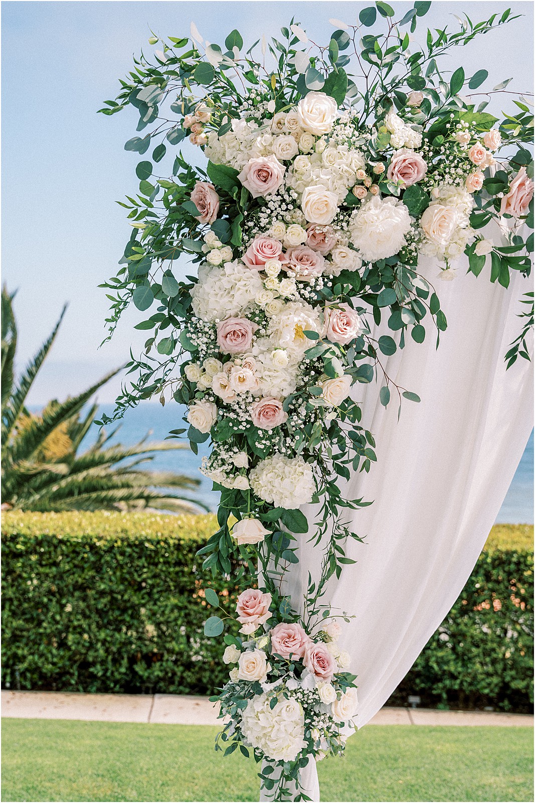 Flowers on arch at wedding in southern California.  