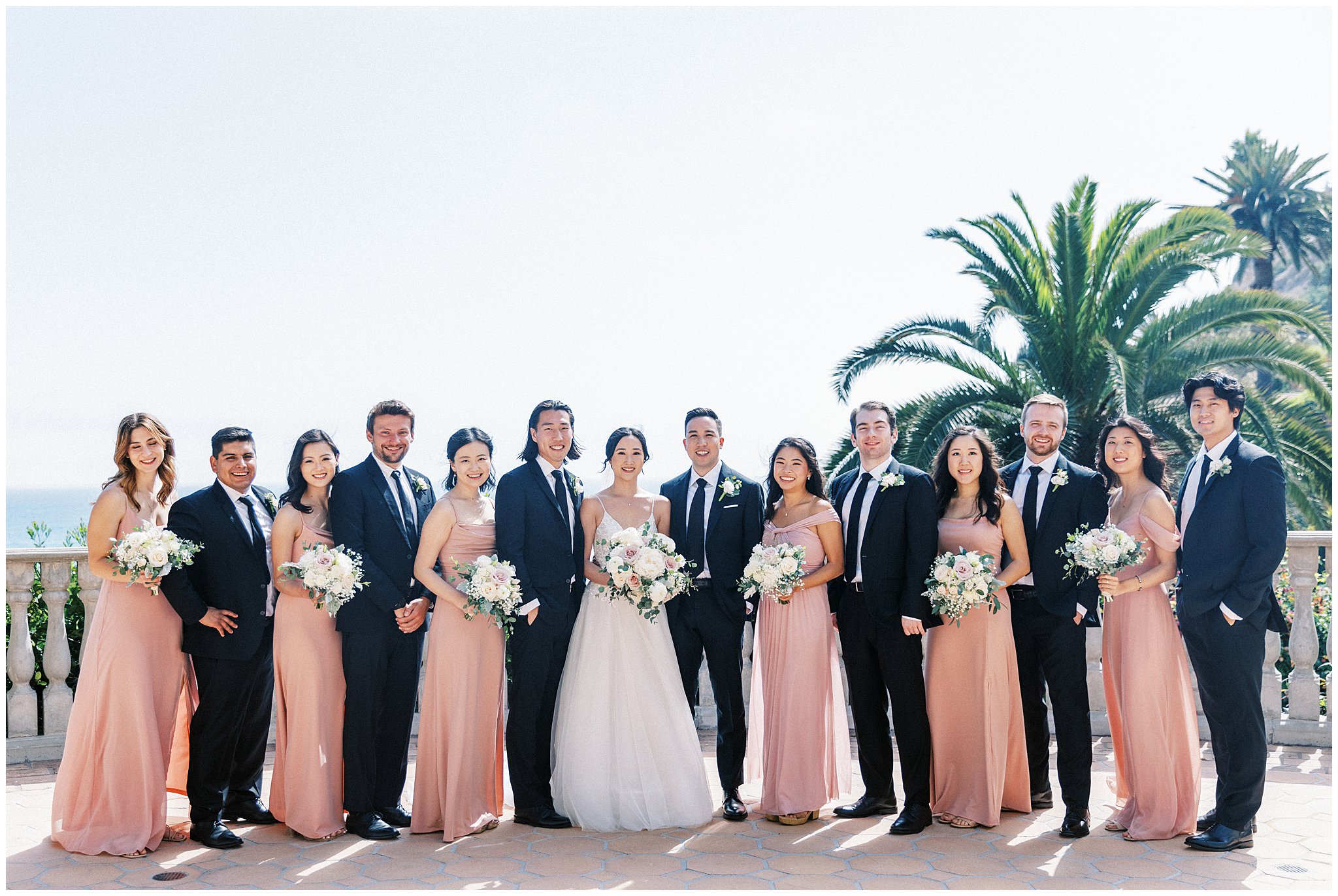 Wedding party on balcony of Bel Air Bay Club in Pacific Palisades, Ca.