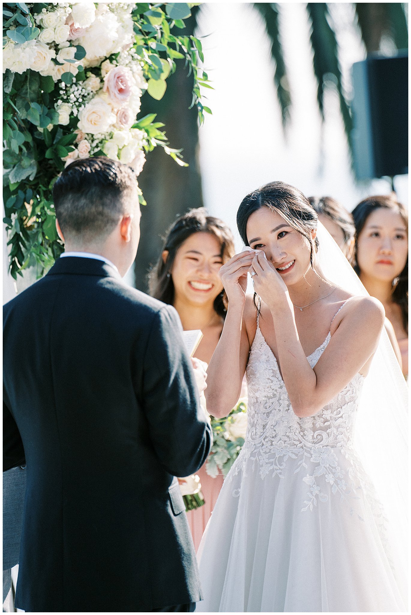 Bride wiping a tear during the grooms vows in Pacific Palisades, Ca.