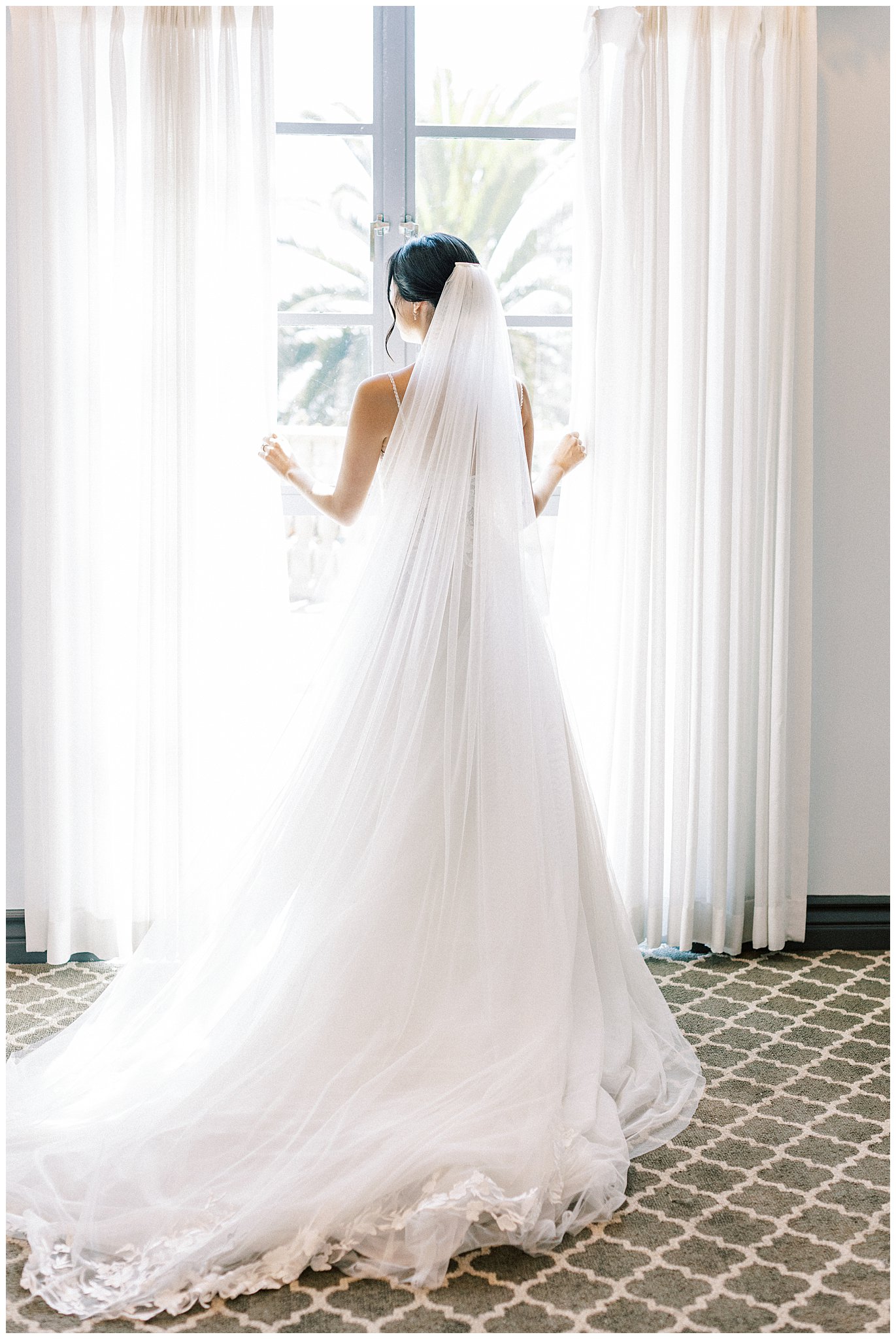 Bride looking out the window at Bel Air Bay Club.