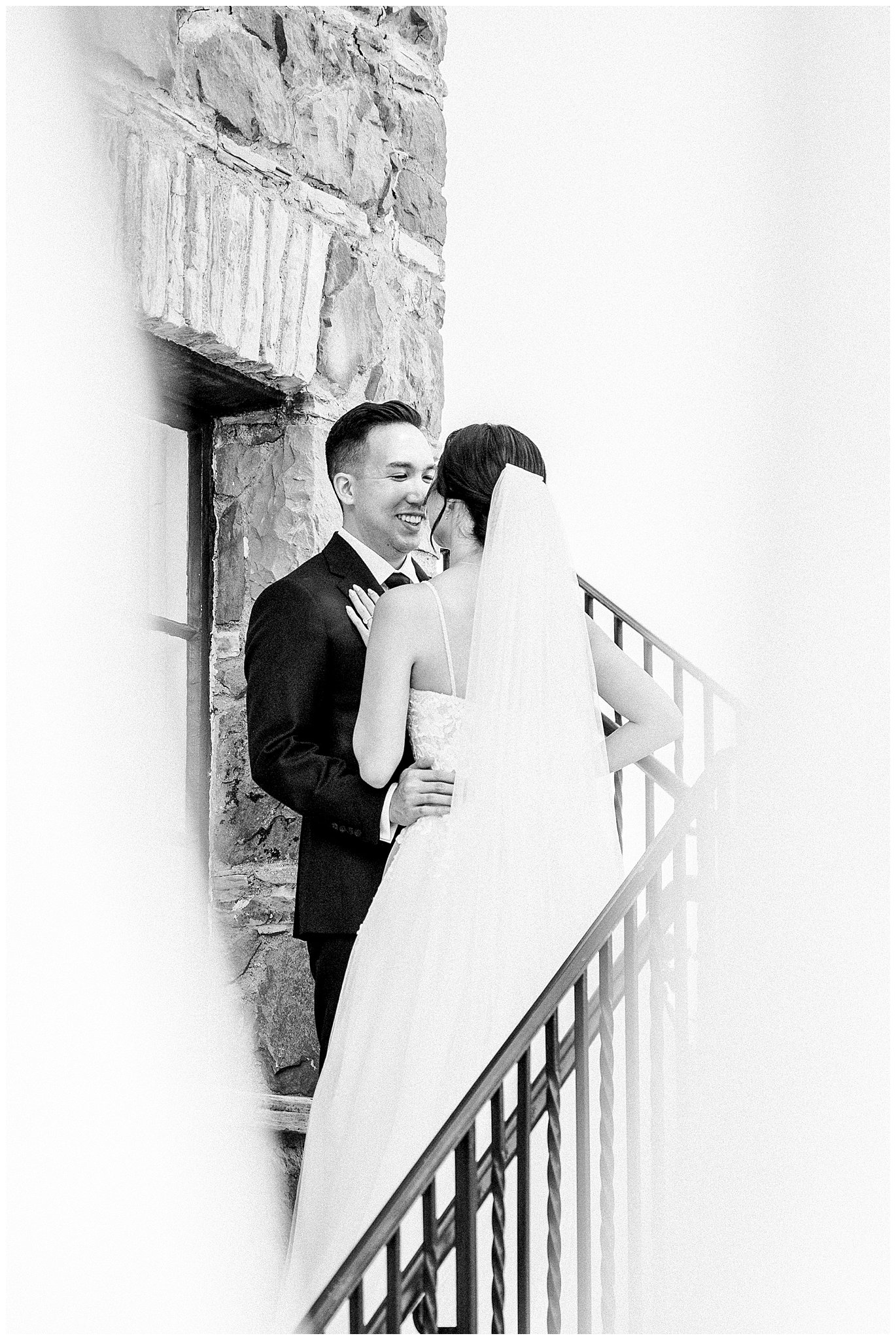 Bride and Groom smiling at each other on the stairs at Bel Air Bay Club.