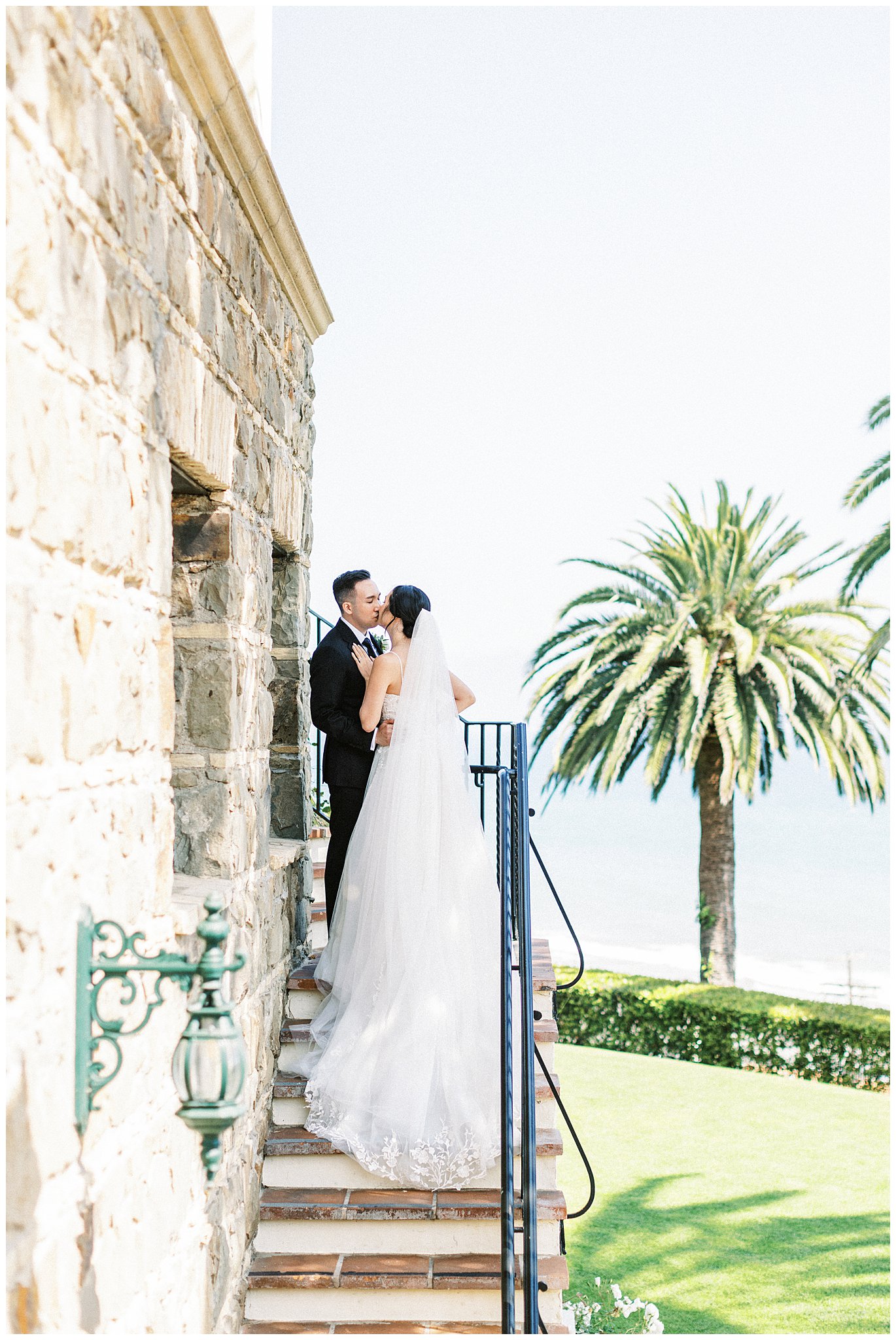 Bride and groom kissing in The Palisades.