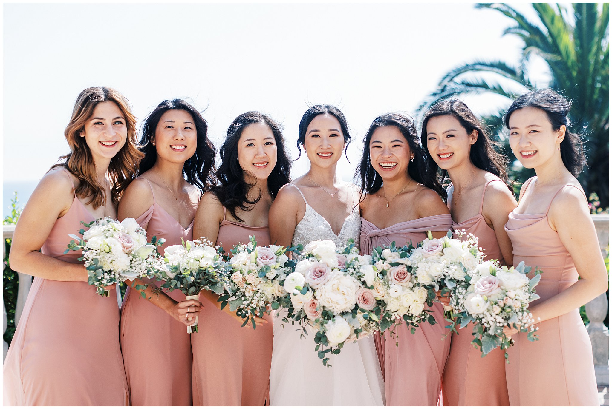 Bride with her bridesmaids on wedding day at Bel Air Bay Club.