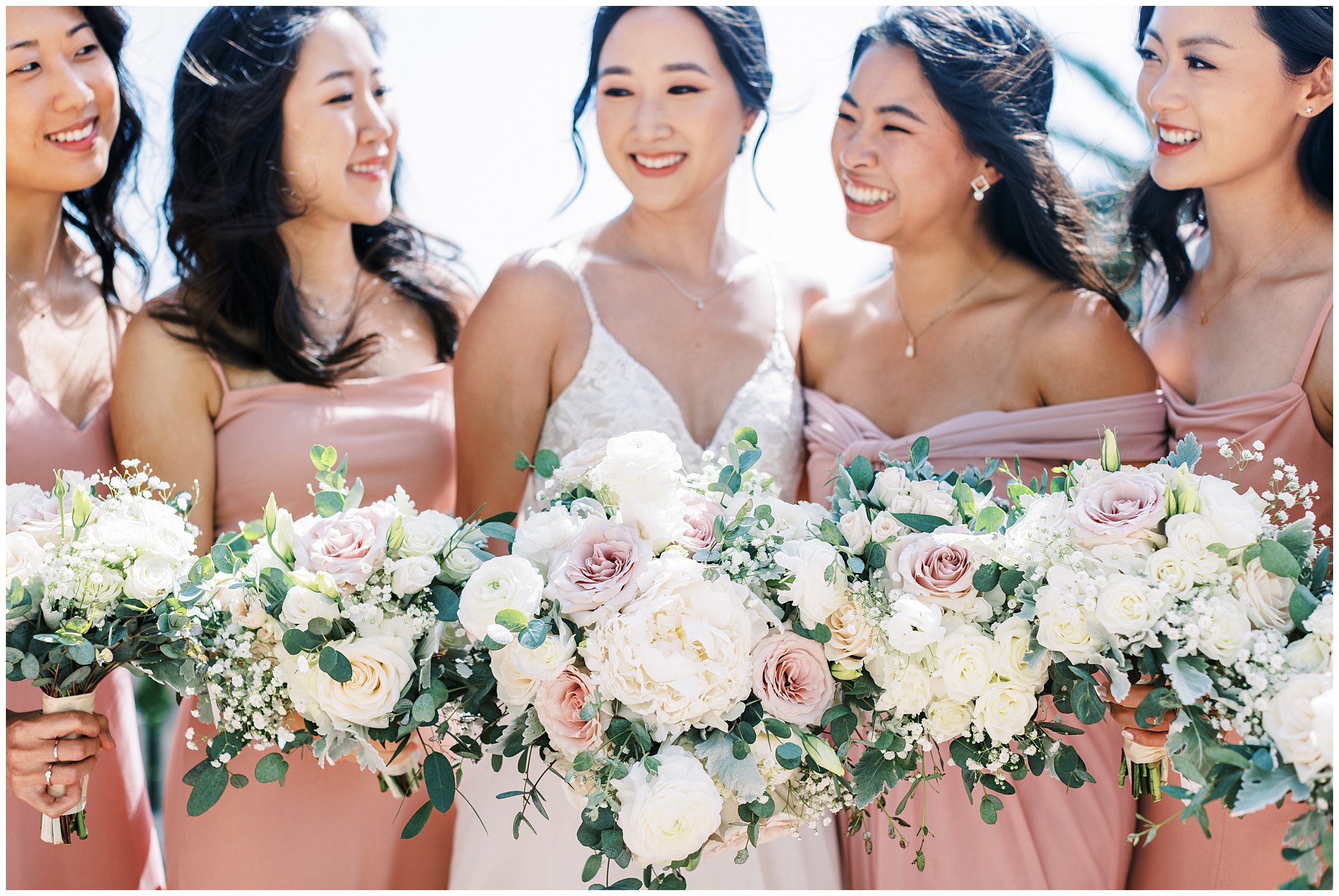 Bride with her bridesmaids on wedding day at Bel Air Bay Club.