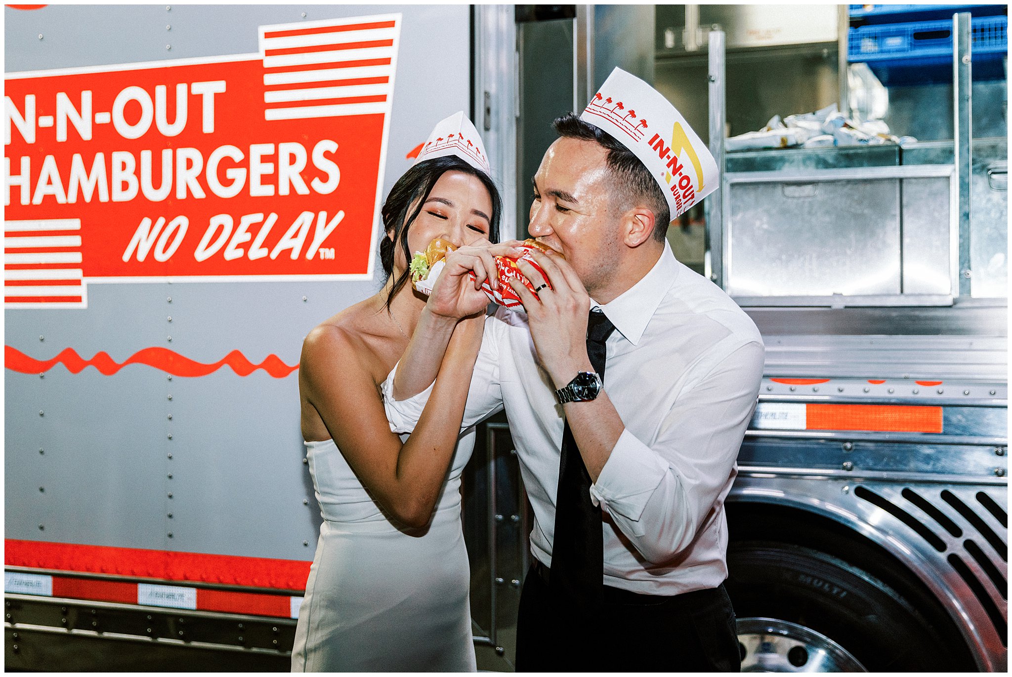 Bride and groom eat a late night cheeseburger from In-N-Out truck at Bel Air Bay Club.