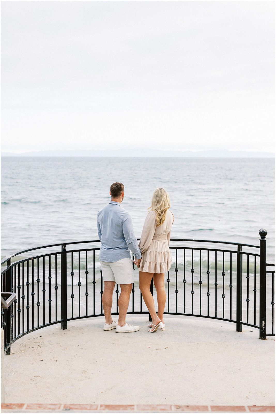 A married couple looking at the ocean in Montecito, Ca.