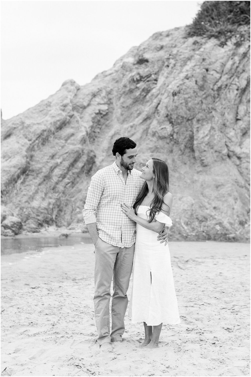 A couple looking at each other at Leo Carrillo beach.