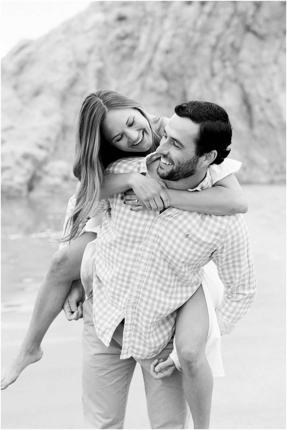 Engaged couple being silly on the beach at Leo Carrillo in Malibu, Ca.