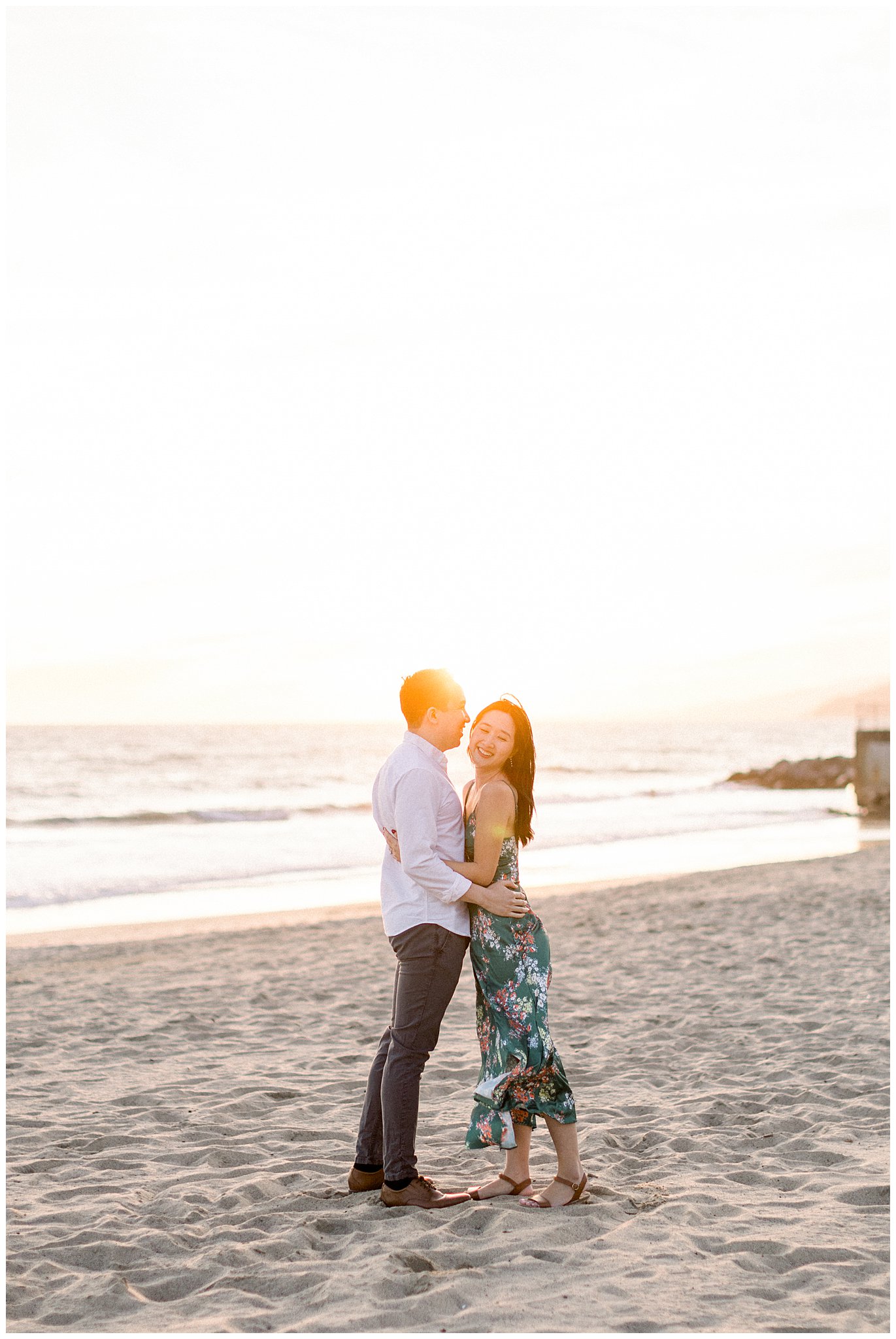 A couple enjoying a quiet moment together at the beach in Pacific Palisades.