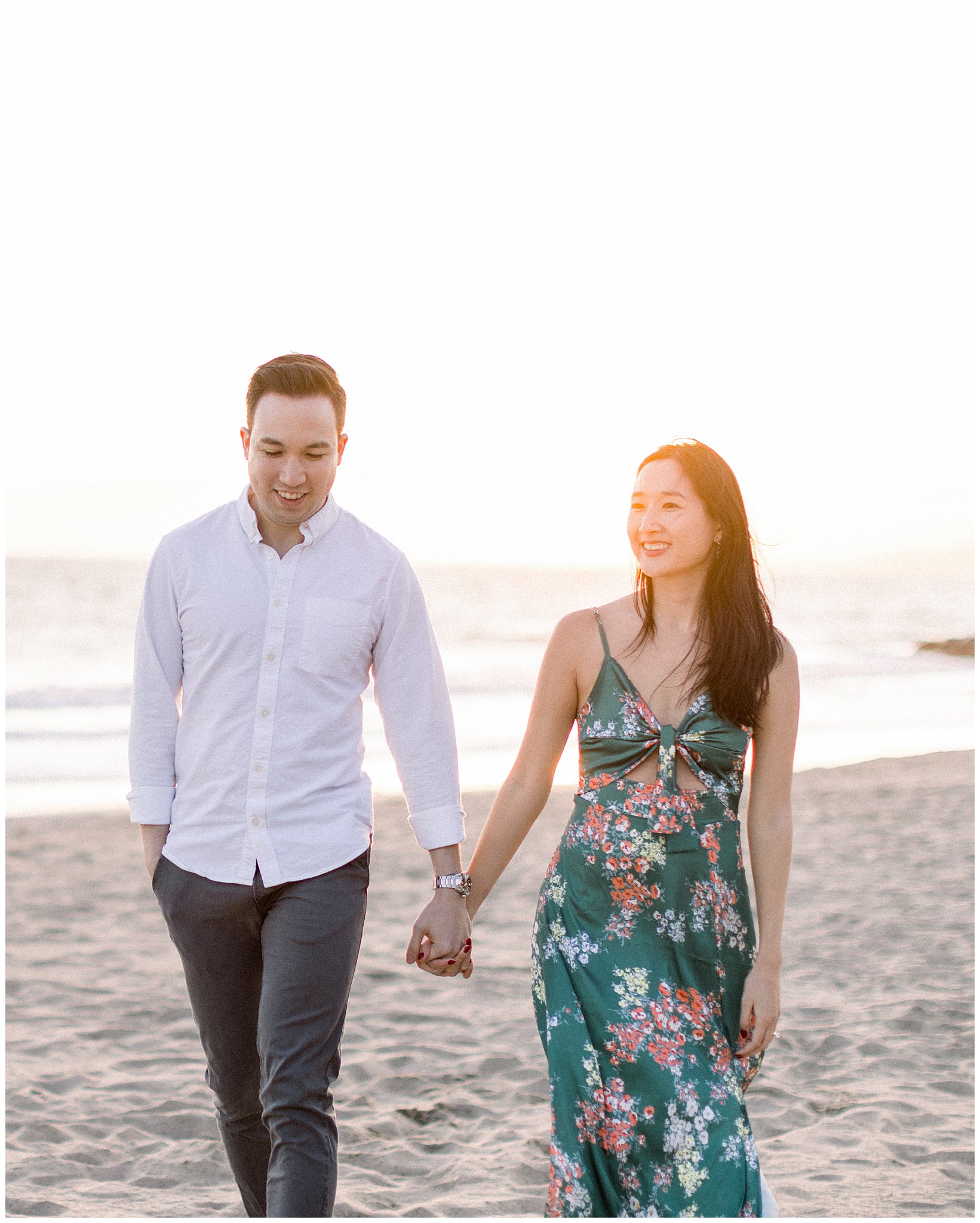 A couple sharing a stroll during a sunset at Will Rogers Beach.