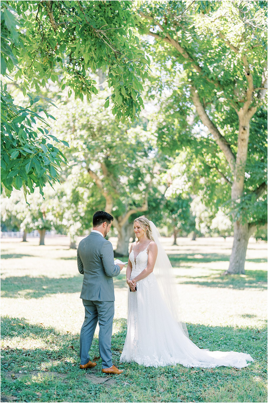 Bride smiling while the groom recites his vows in Moorpark, Ca.