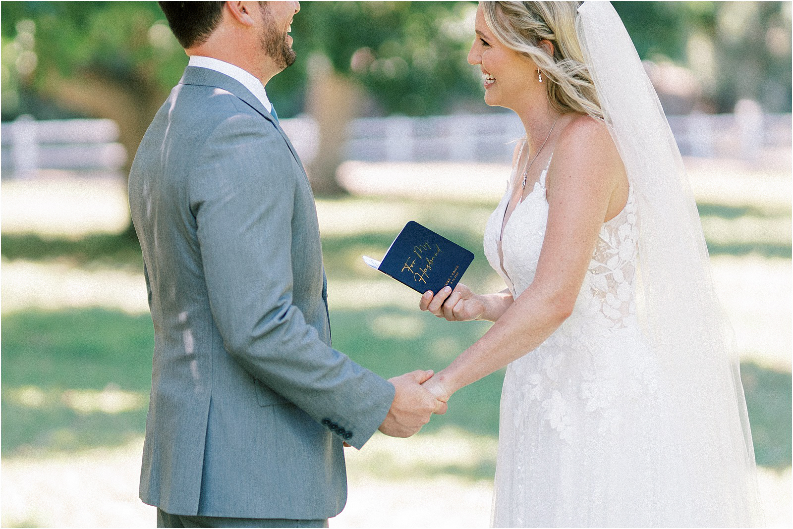 A sweet moment of laughter while the bride and groom recite their vows in Moorpark, Ca.