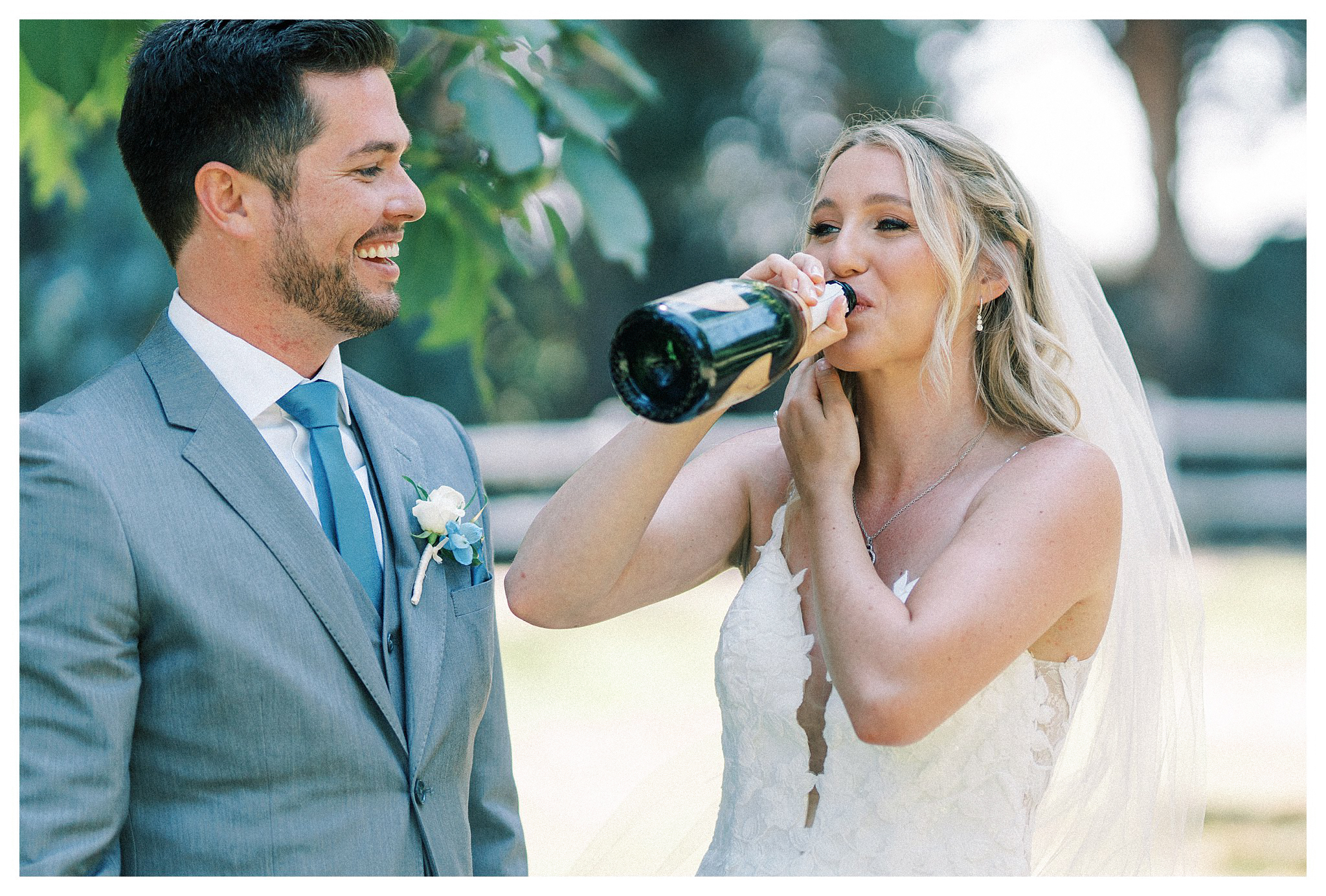 Bride drinking from a bottle of champagne in Moorpark, Ca. 