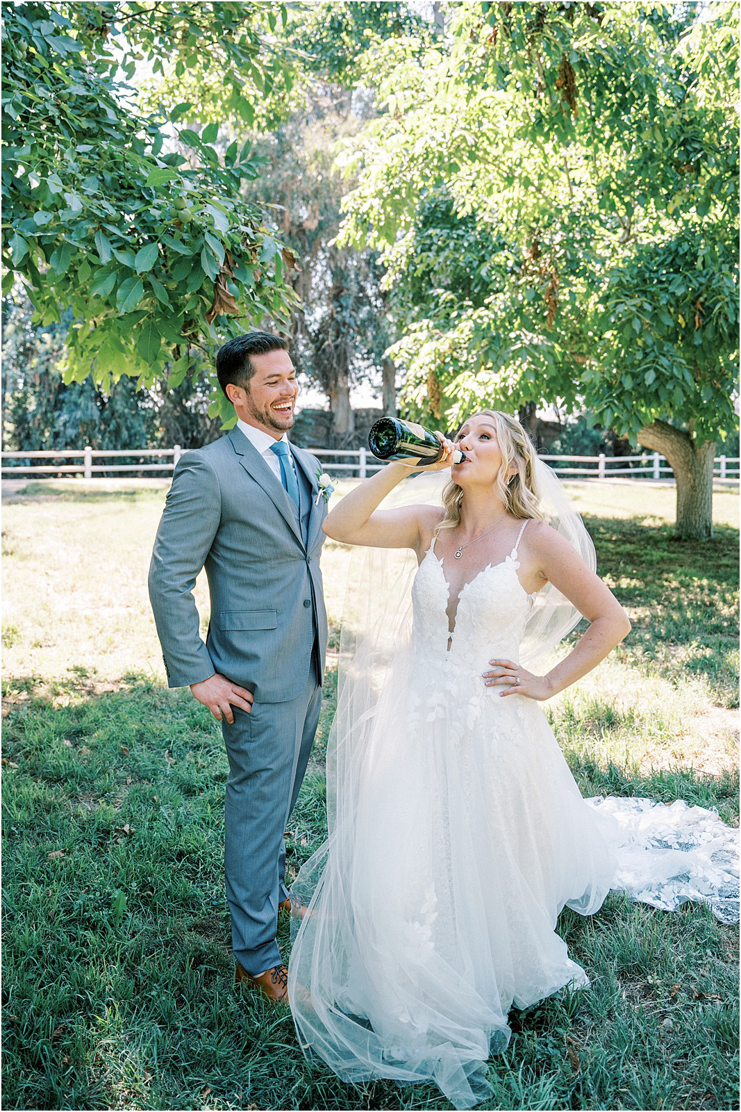 Bride drinking from a bottle of champagne in Moorpark, Ca. 