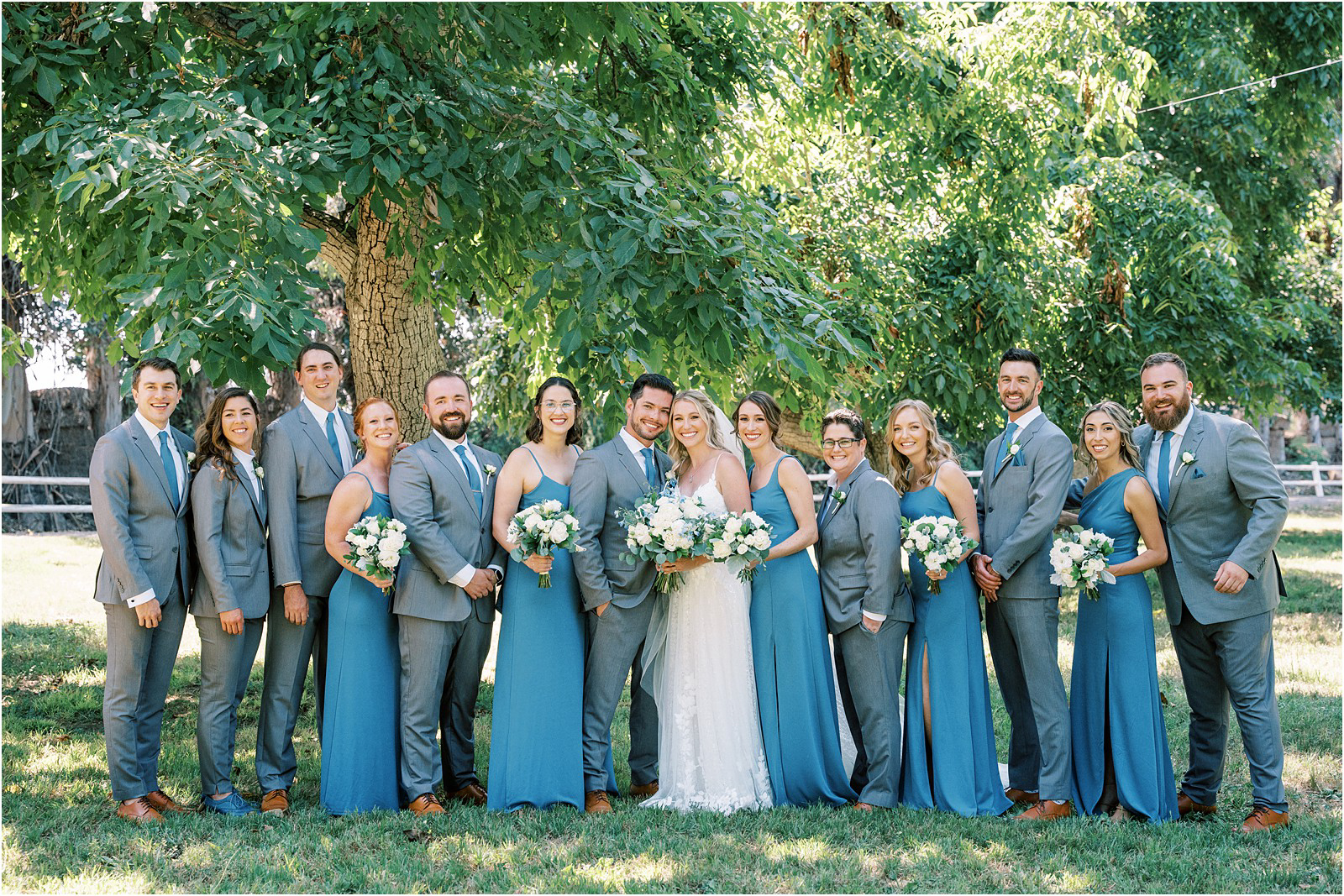 The wedding party smiling at Walnut Grove in Moorpark, Ca.