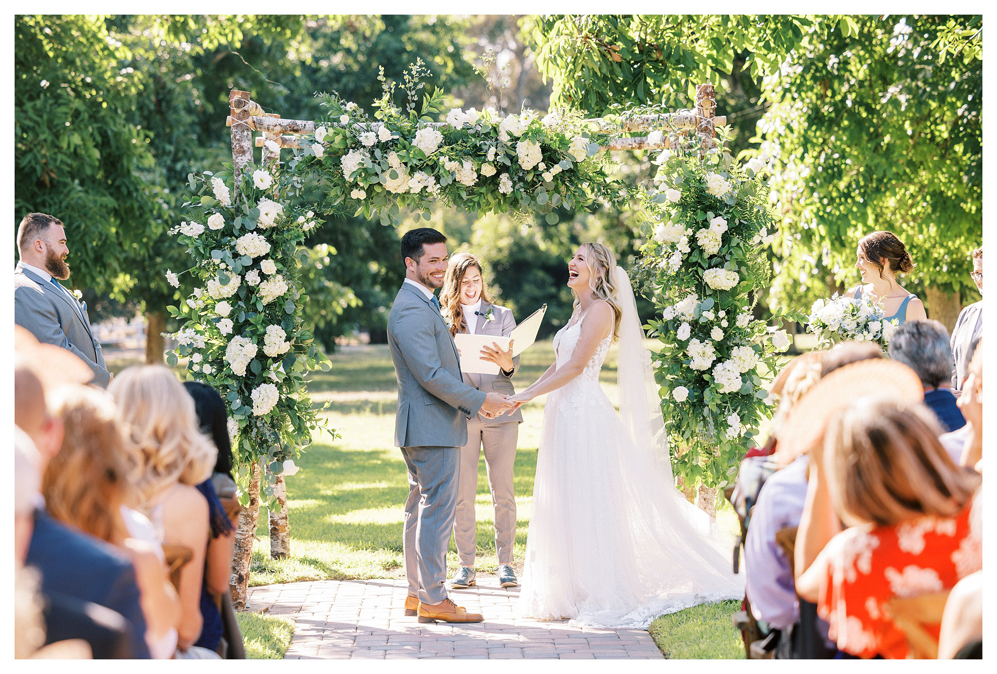 The bride and groom laughing during their wedding ceremony in Moorpark, Ca.