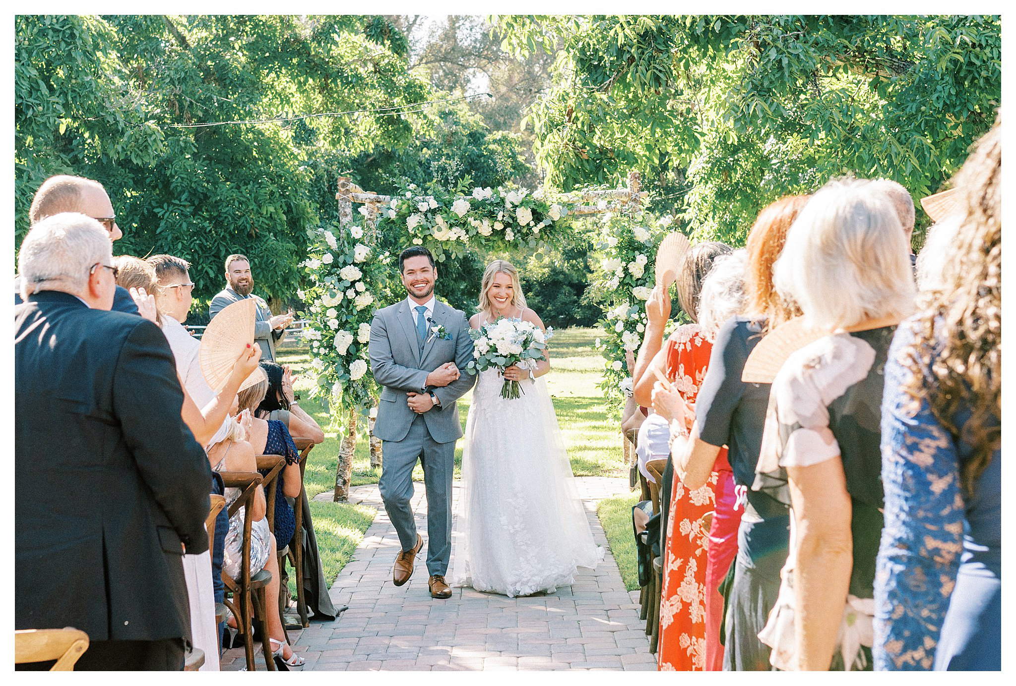 The newlyweds processional full of smiles in Moorpark, Ca.