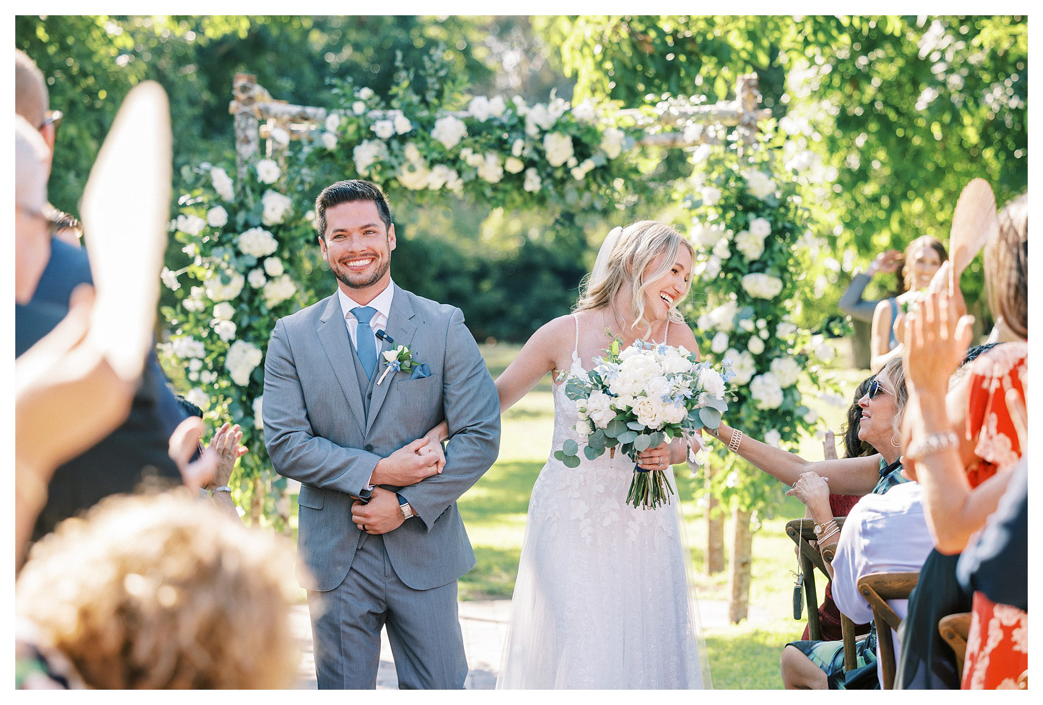 The newlyweds processional full of smiles in Moorpark, Ca.