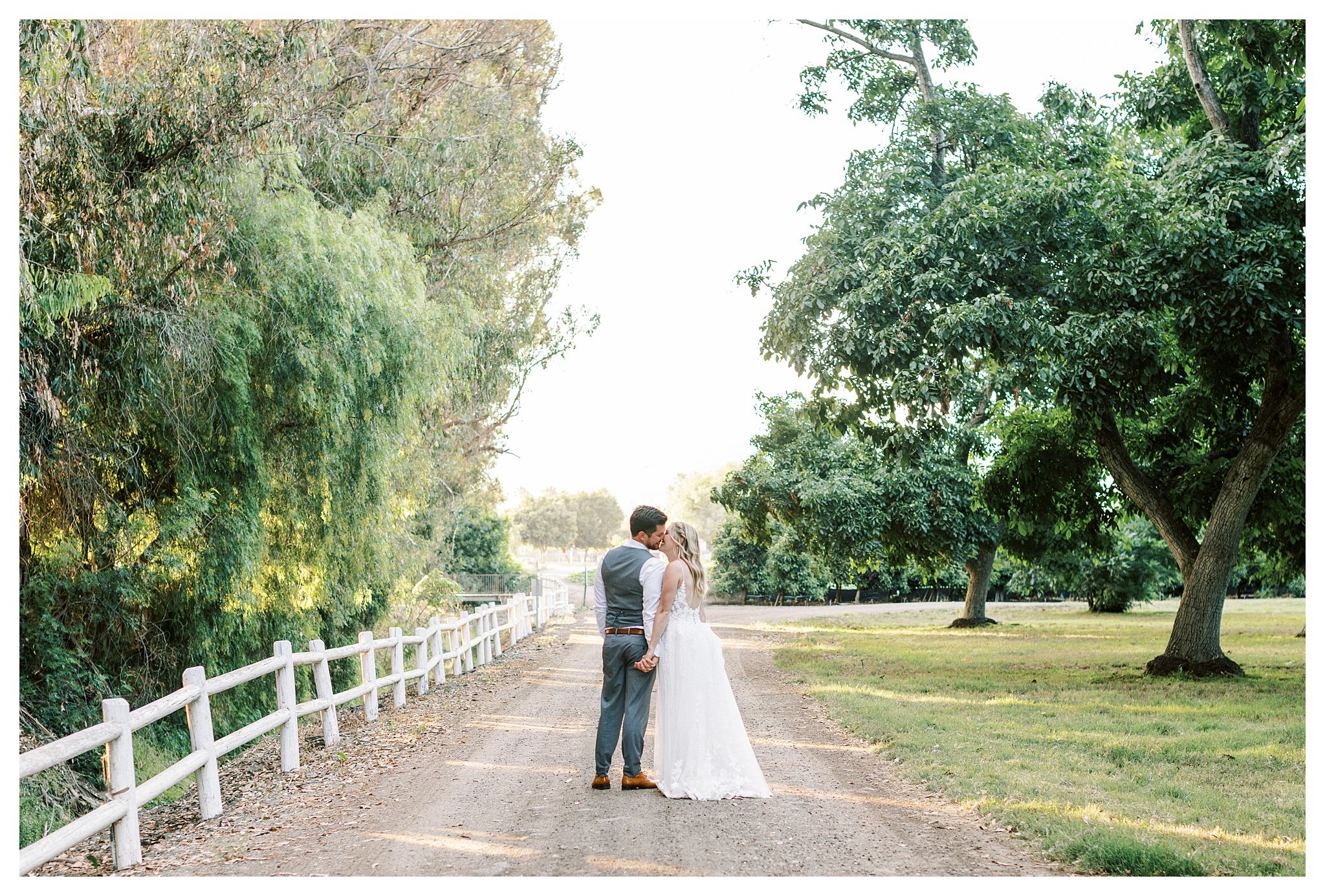 Bride and groom kiss during sunset photos at Walnut Grove in Moorpark, Ca.