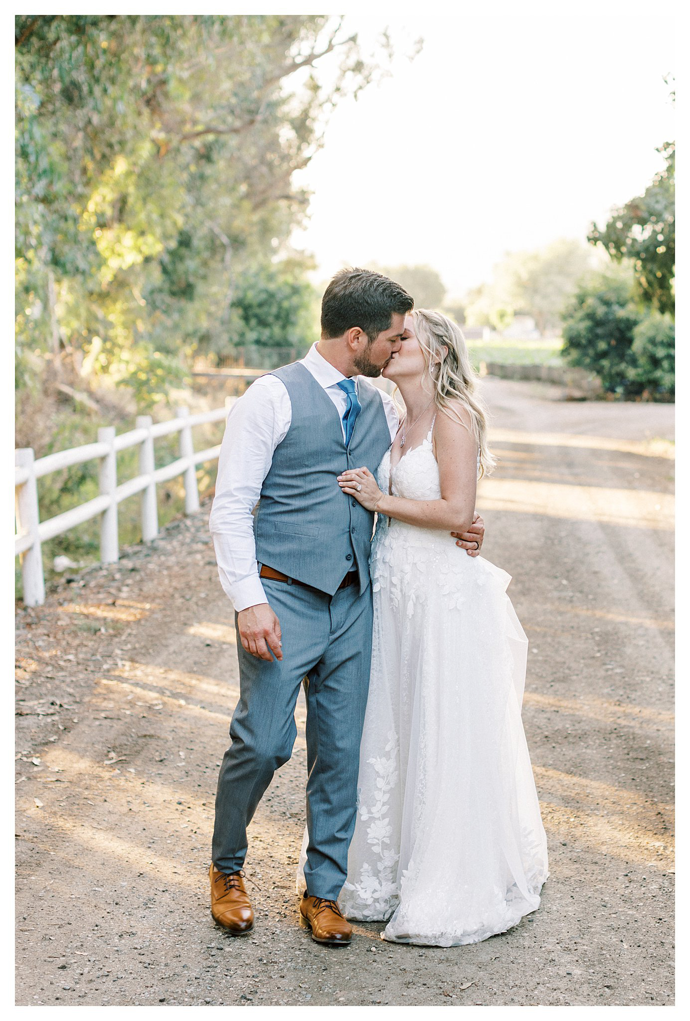 The newlyweds share a kiss during golden hour.  