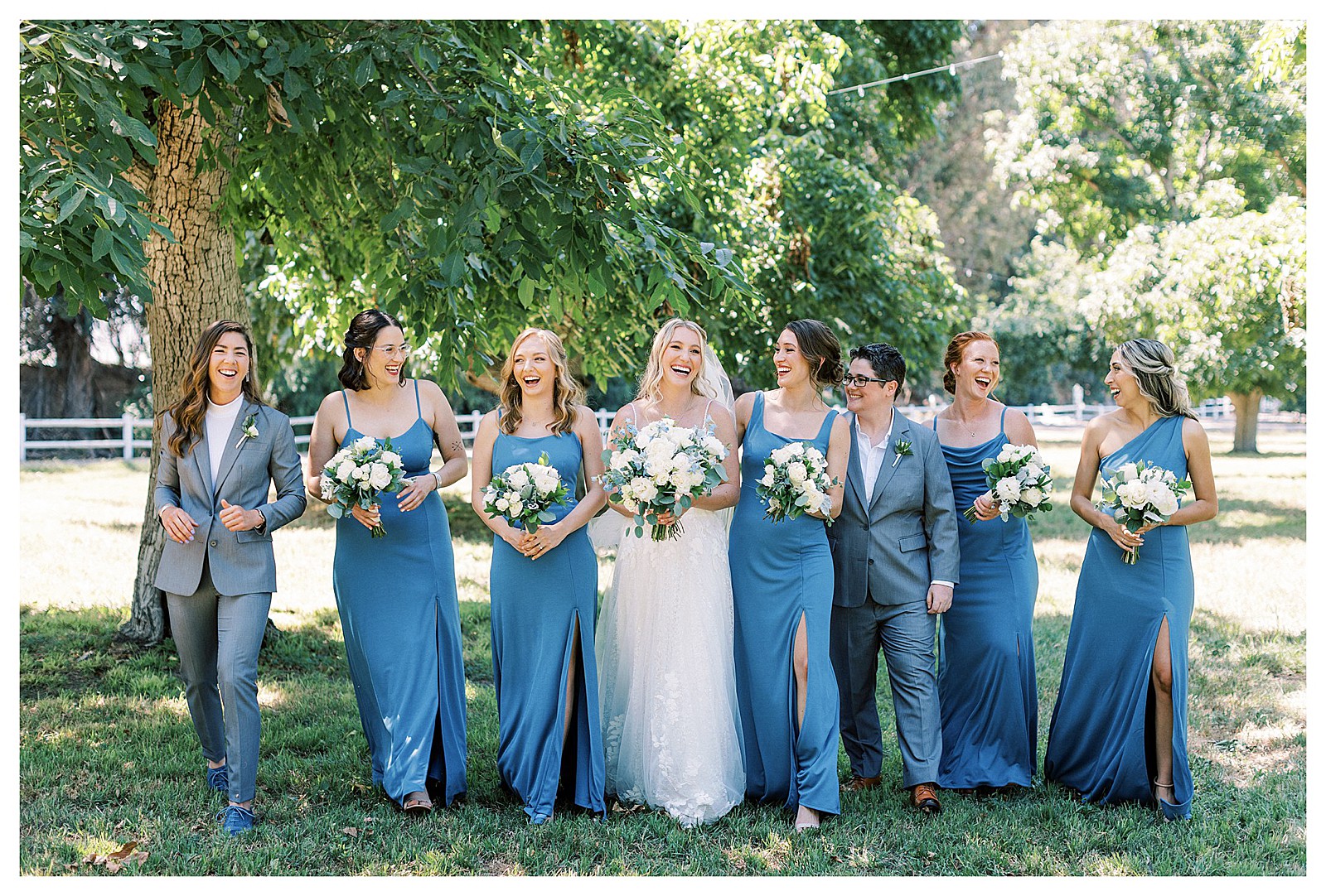 Bride and her bridesmaids walking together at Walnut Grove in Moorpark, Ca.