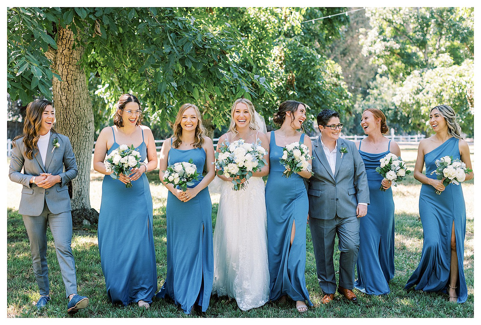 Bride and her bridesmaids laughing and walking at Walnut Grove, in Moorpark, Ca.