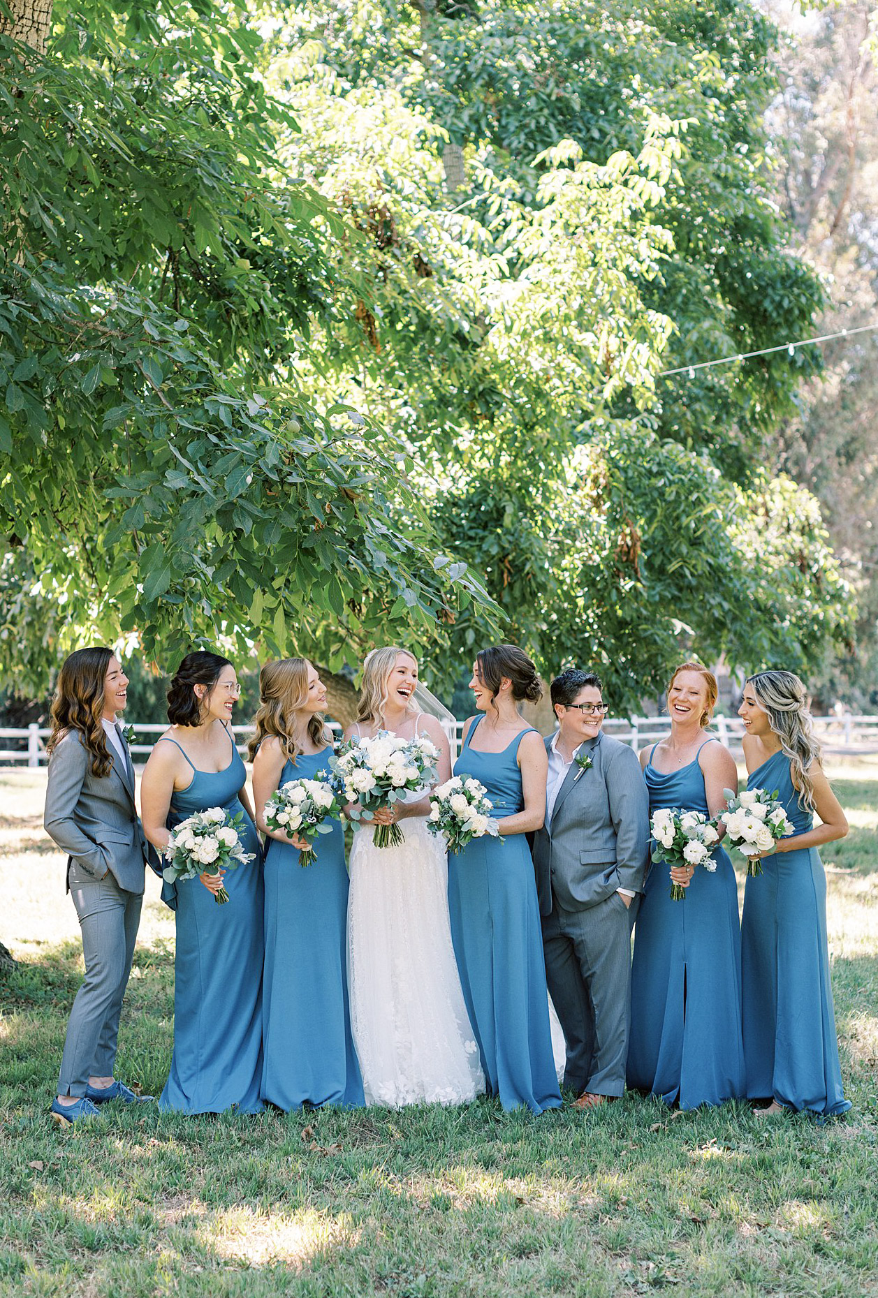 Bride laughing with her bridesmaids in Moorpark, Ca.