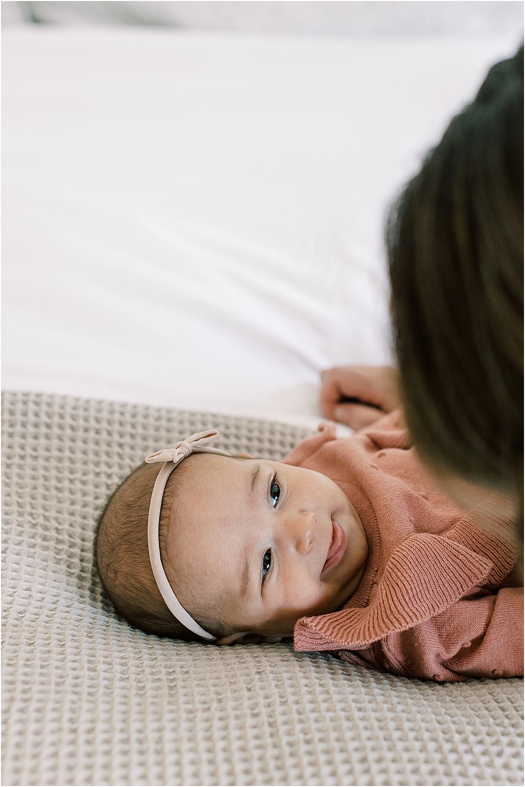 Candid moment of baby smiling during lifestyle newborn session in Thousand Oaks