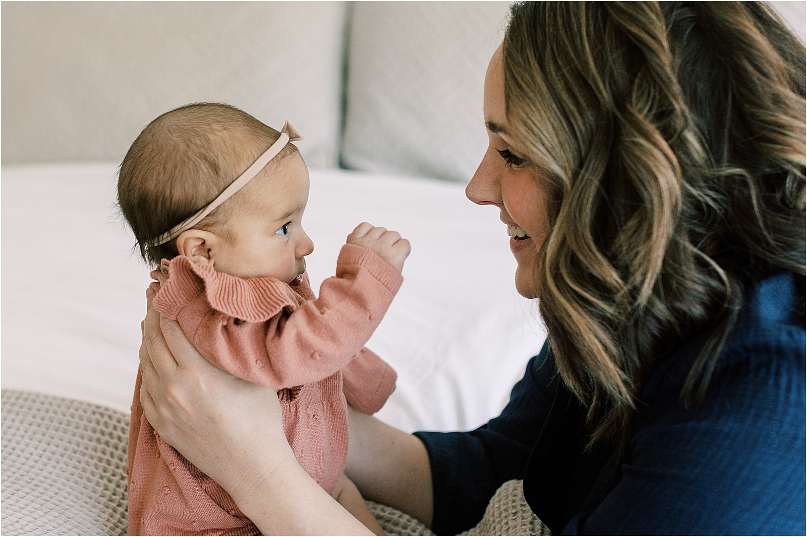 Mom and baby sharing a quiet moment during in-home family session