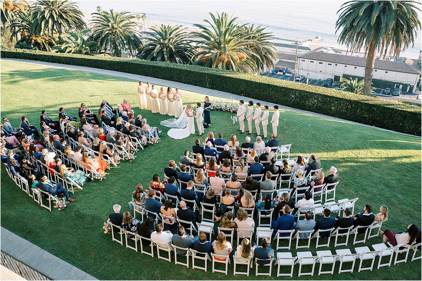 wide ceremony photo with guests and coastal scenery at bel air bay club