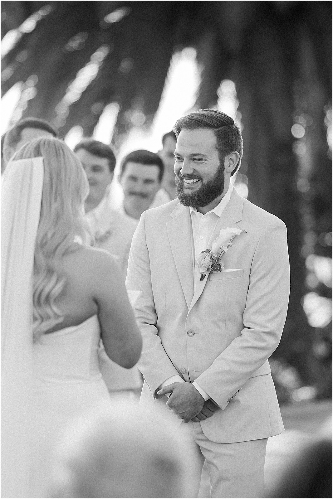 groom laughing and smiling during ceremony