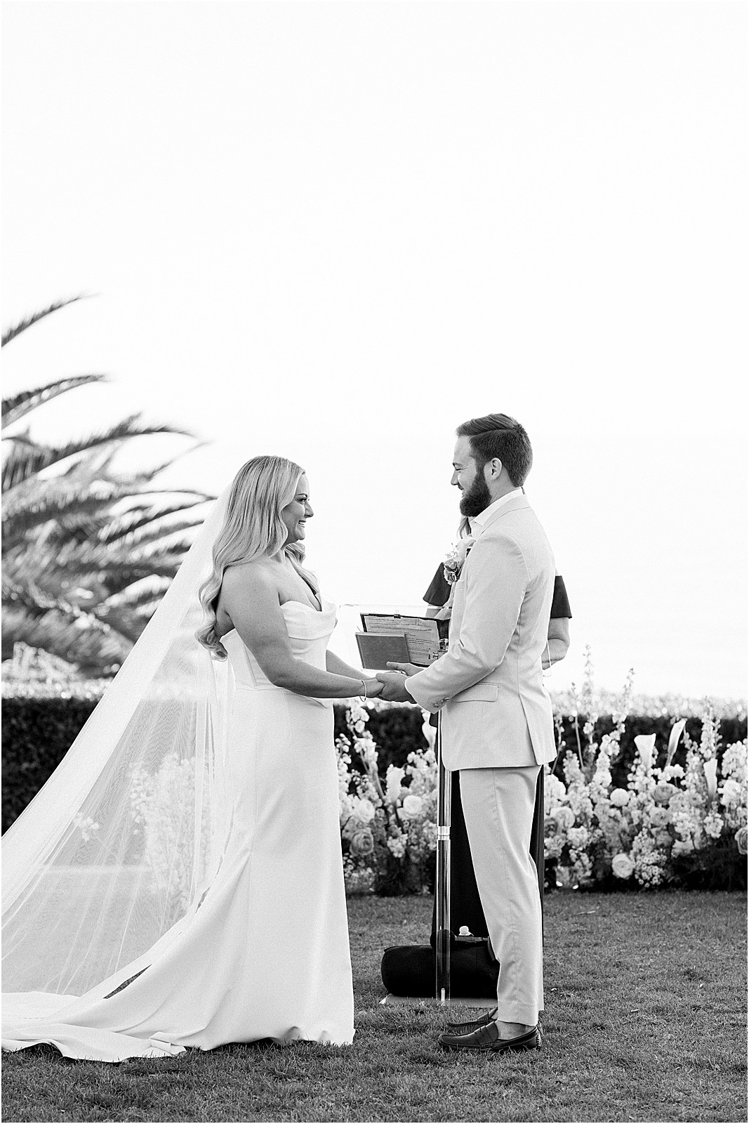 couple holding hands during their ceremony at bel air bay club