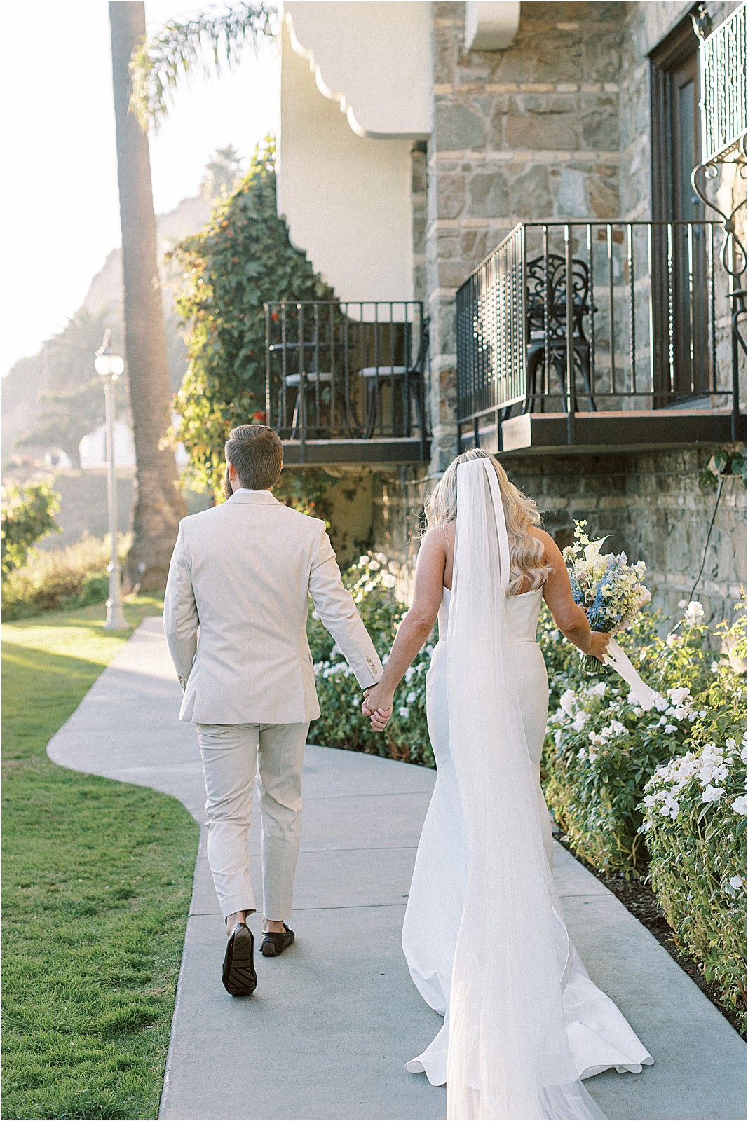 couple walking away after the ceremony at bel air bay club in pacific palisades