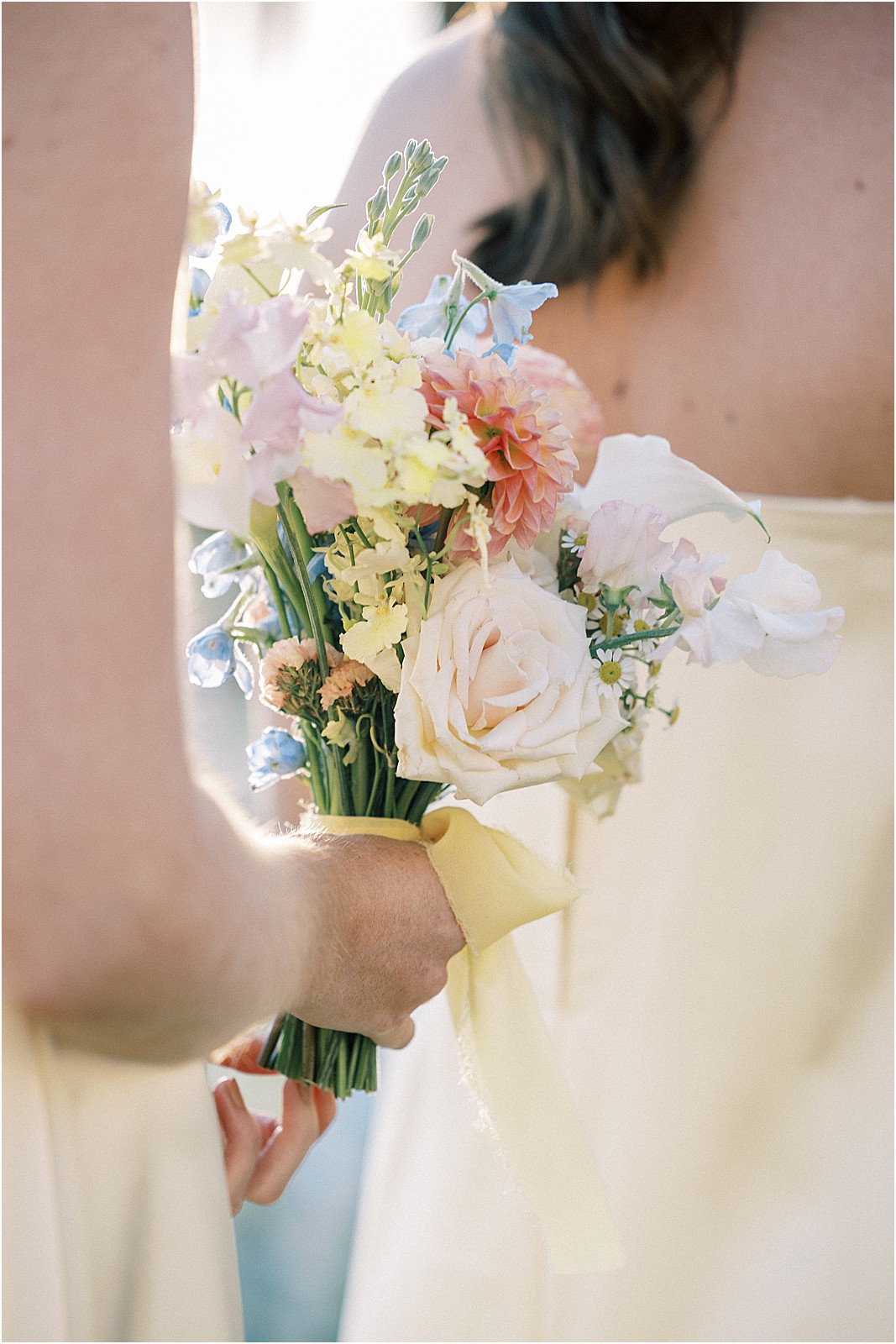 a close up of bridesmaids bouquet during ceremony