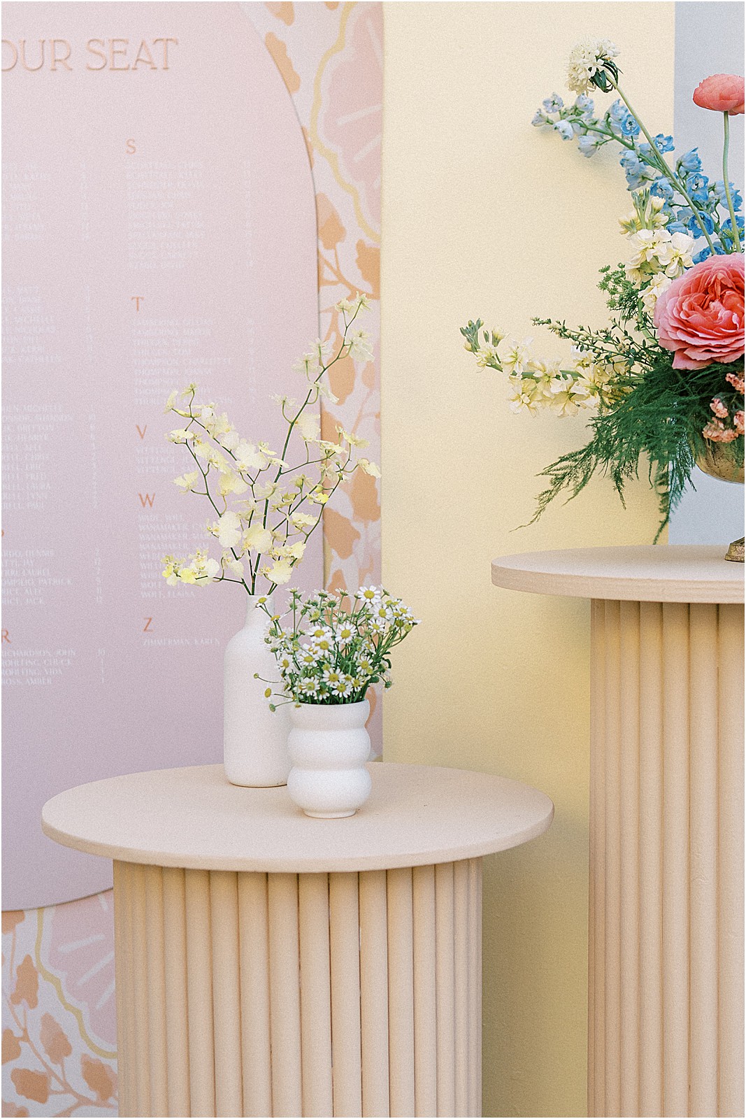 close up of floral arrangement by seating chart at bel air bay club