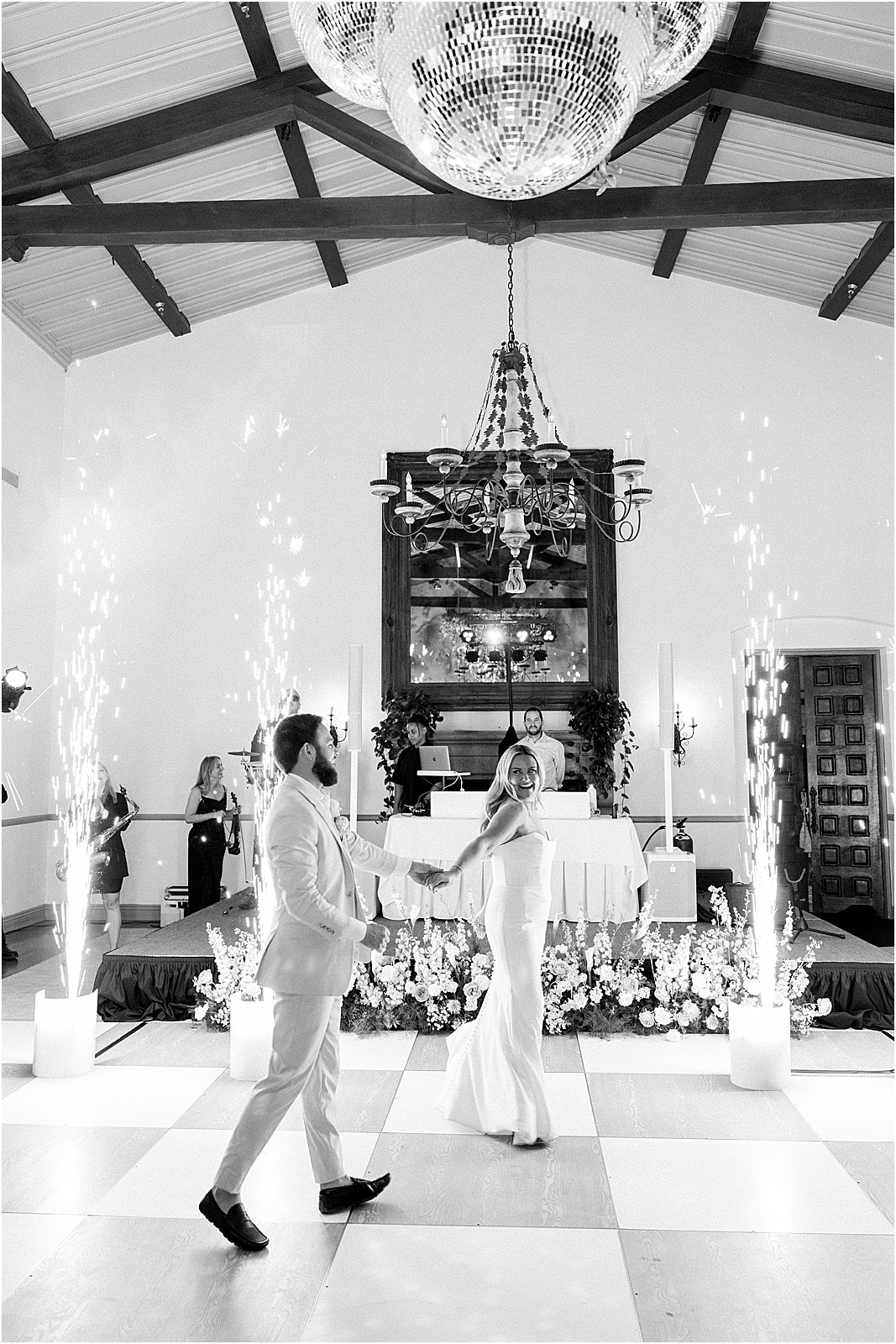 bride and groom sharing their first dance in front of cold sparklers at bel air bay club