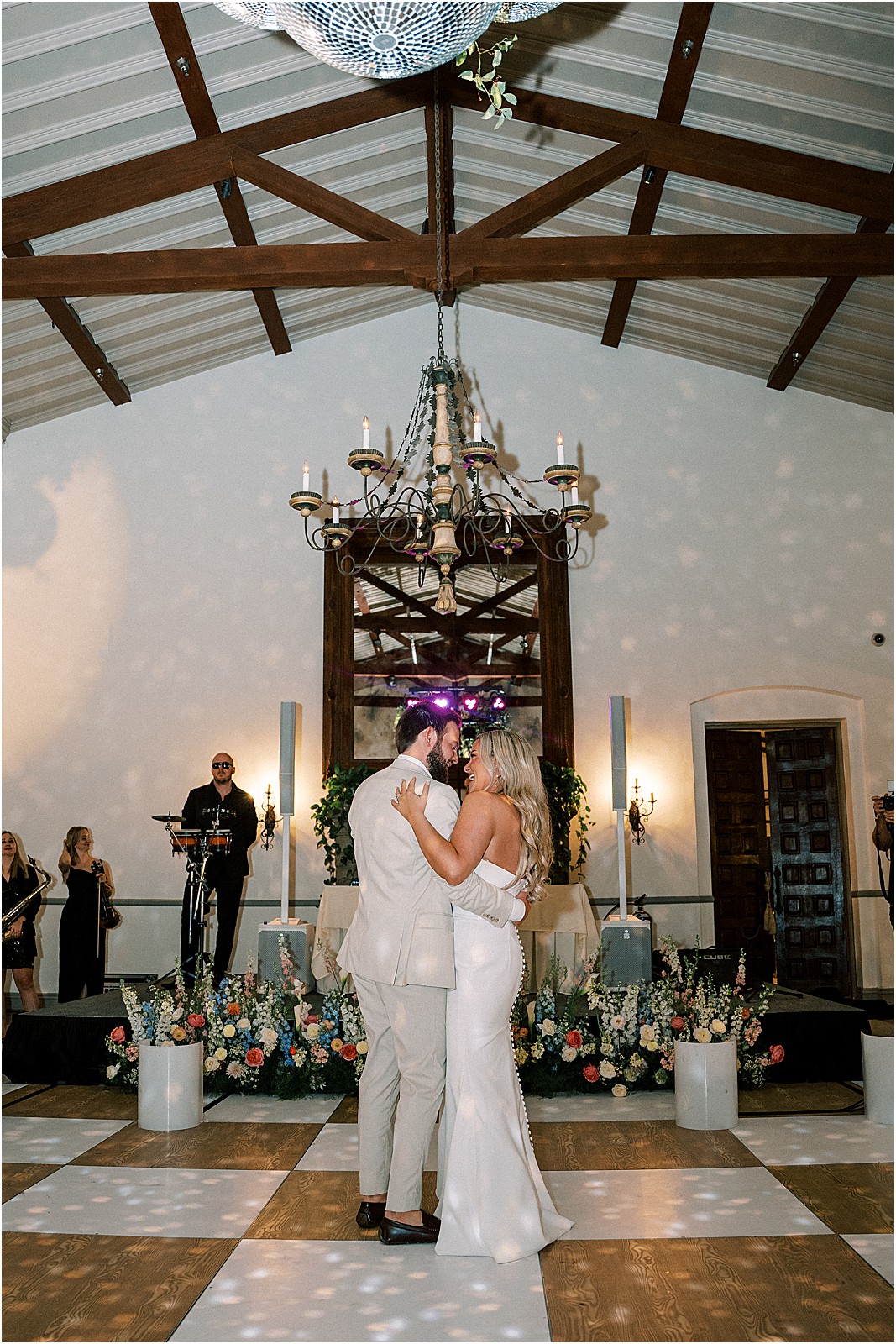 couple dancing together as the live band performs