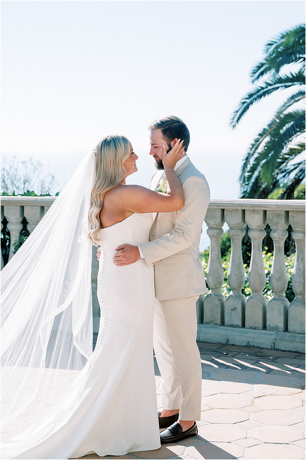 couple smiling closely at each other during the first look
