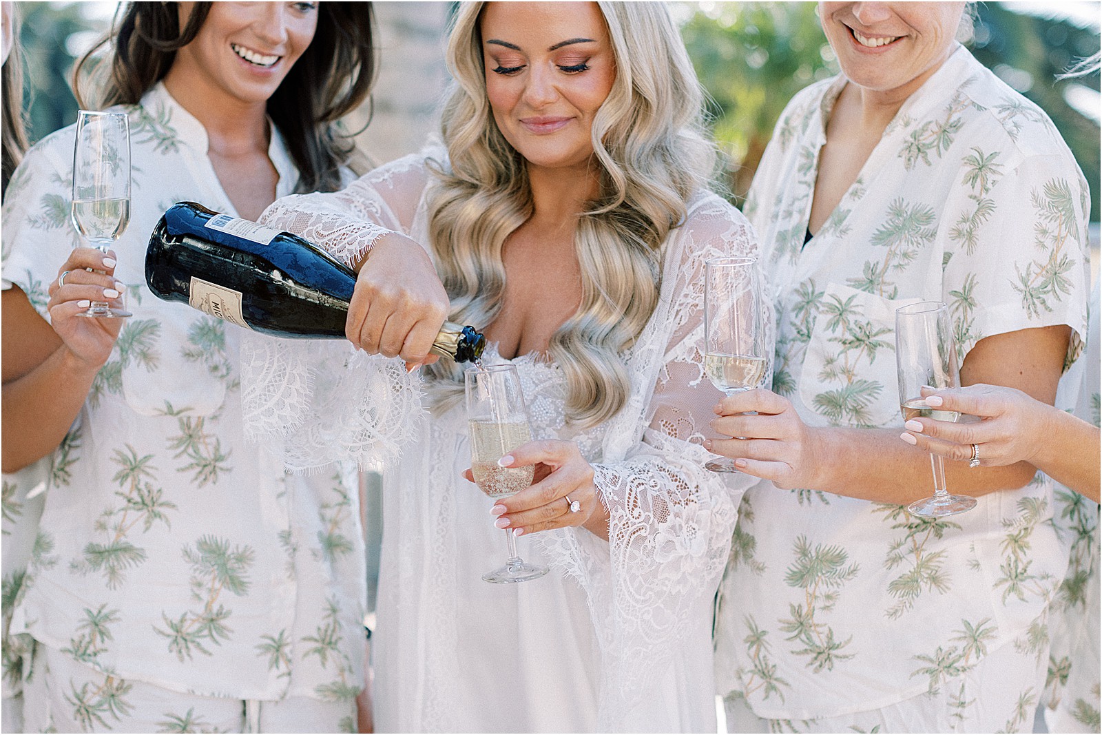 close up of bride pouring champagne
