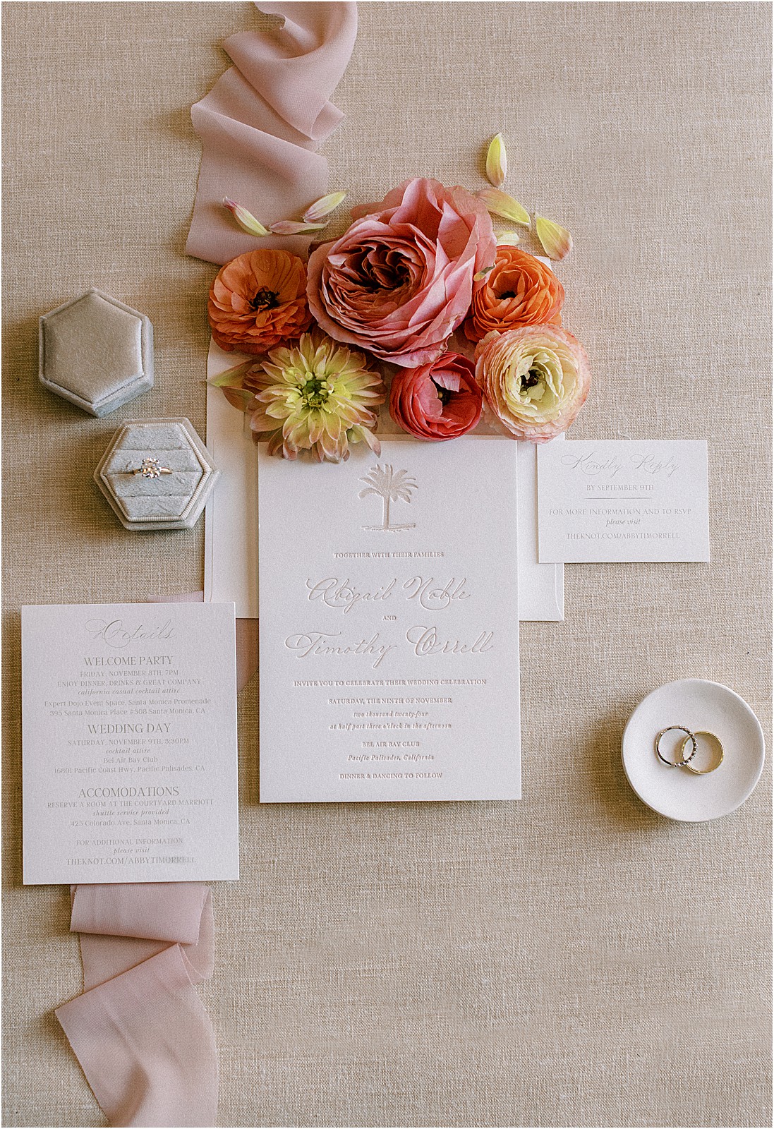 wedding invitation suite styled with florals and ribbon