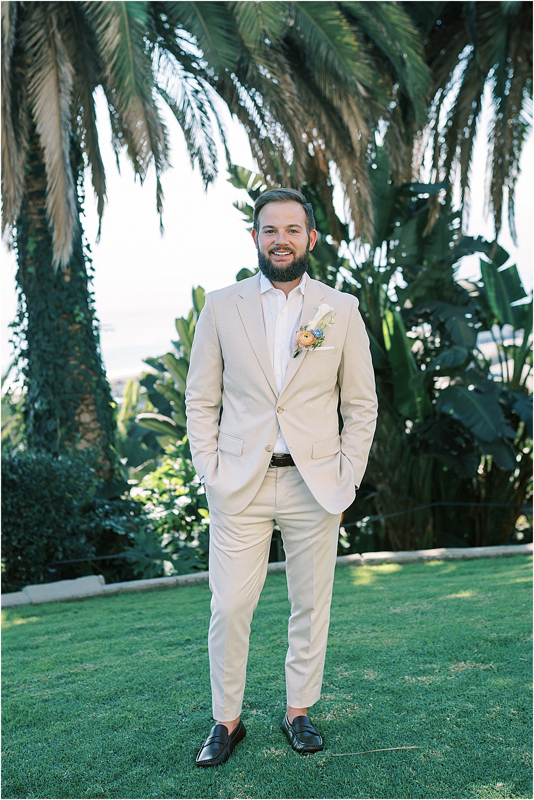 groom posing for a photo before first look at bel air bay club