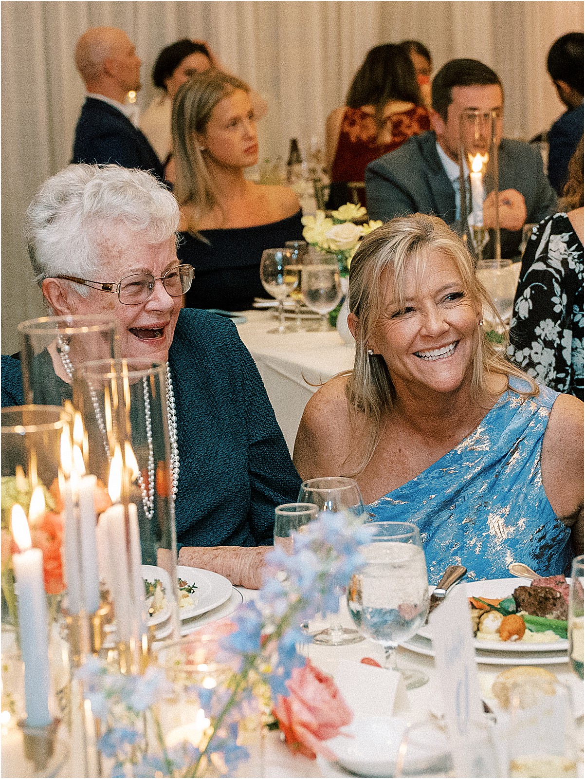 guests laughing and mingling during the reception