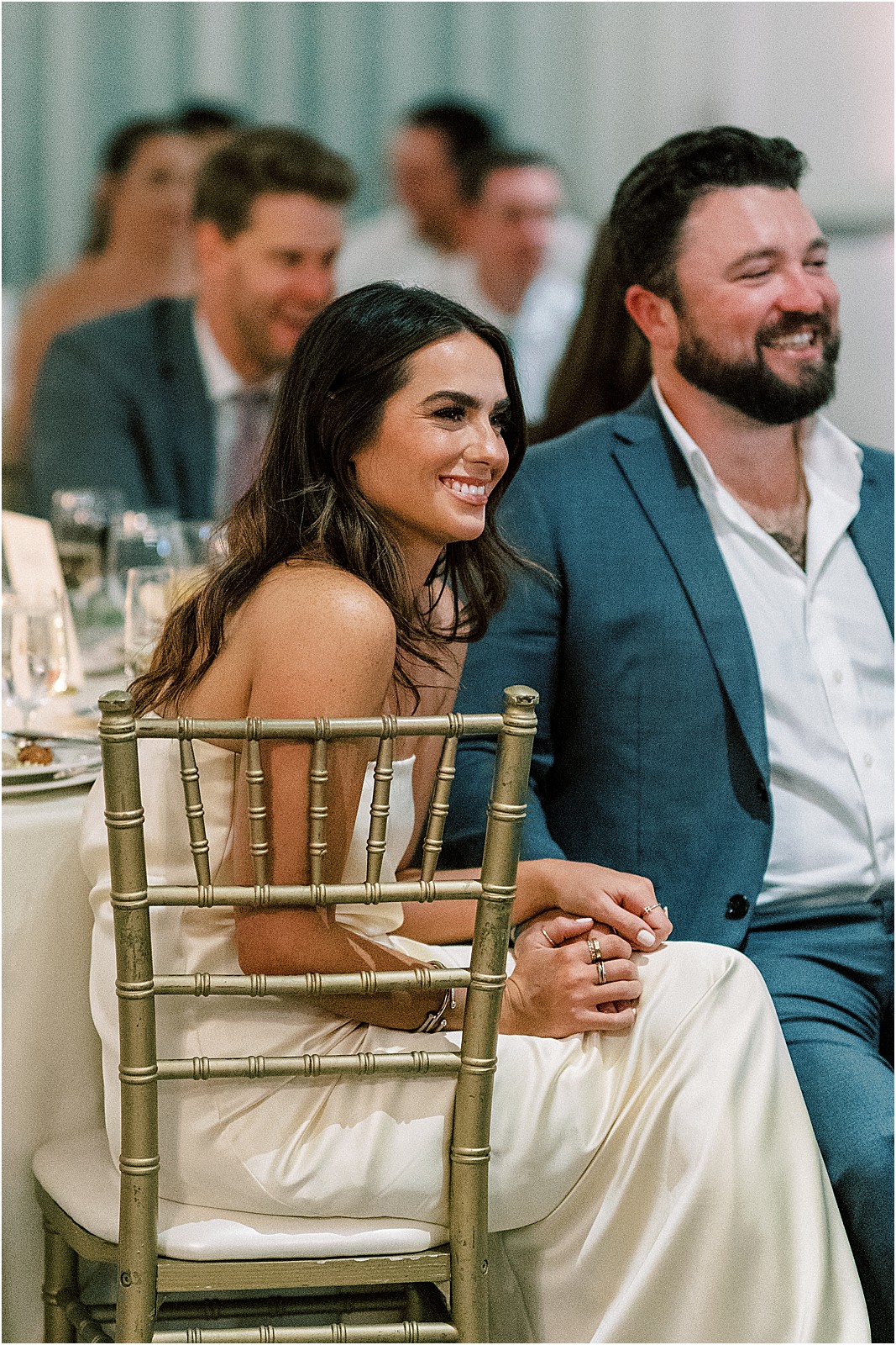 candid moment of guest during toasts at the reception